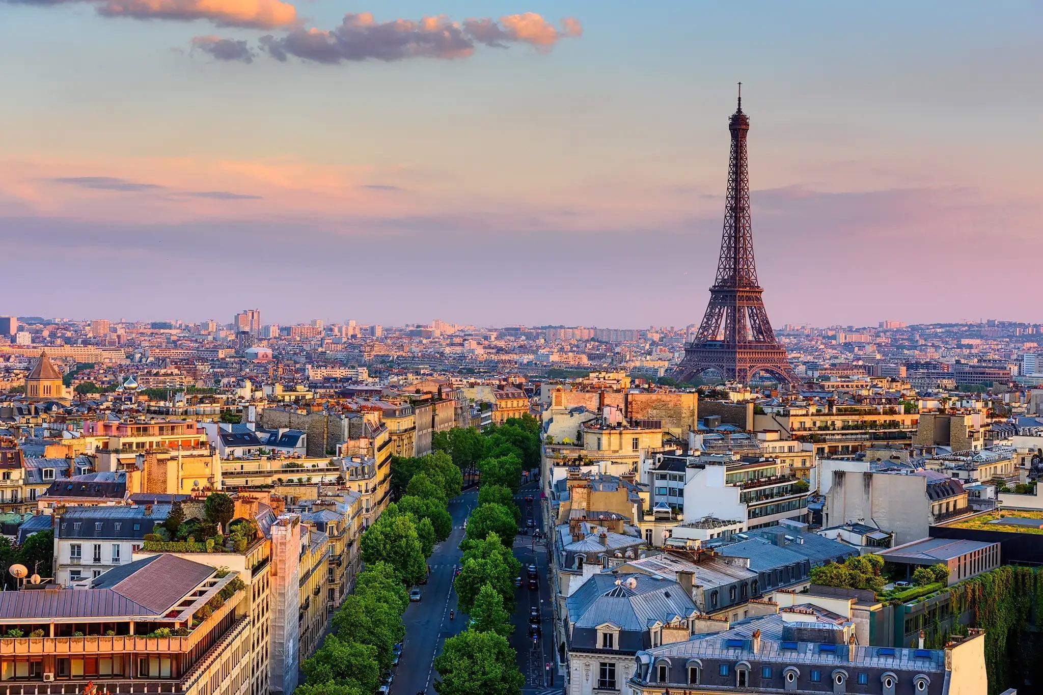 View of Paris with the Eiffel Tower at sunset, representing French culture, language, and history explored through the French and History BA (Hons) degree.