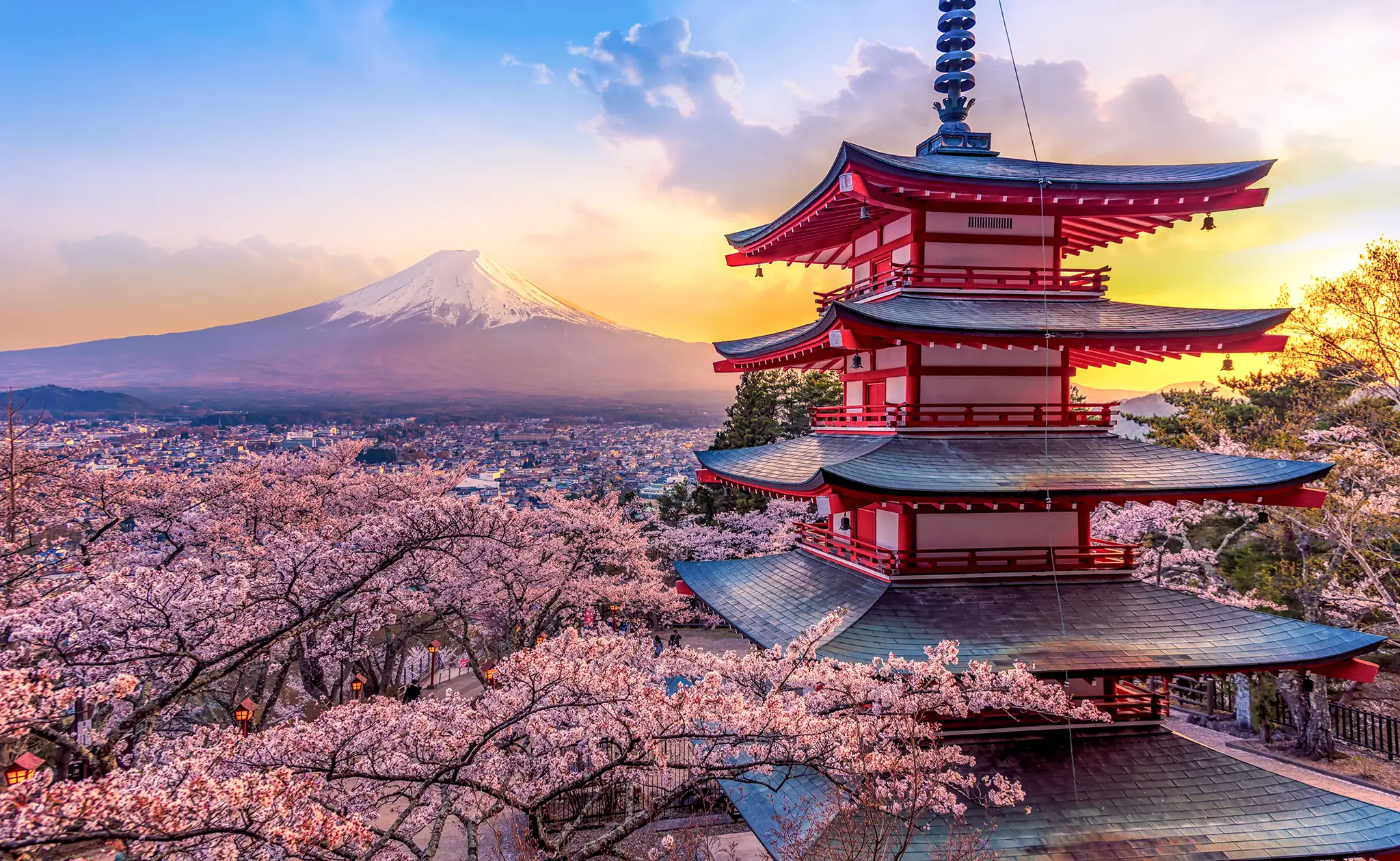 View of Mount Fuji and Chureito pagoda at sunset.