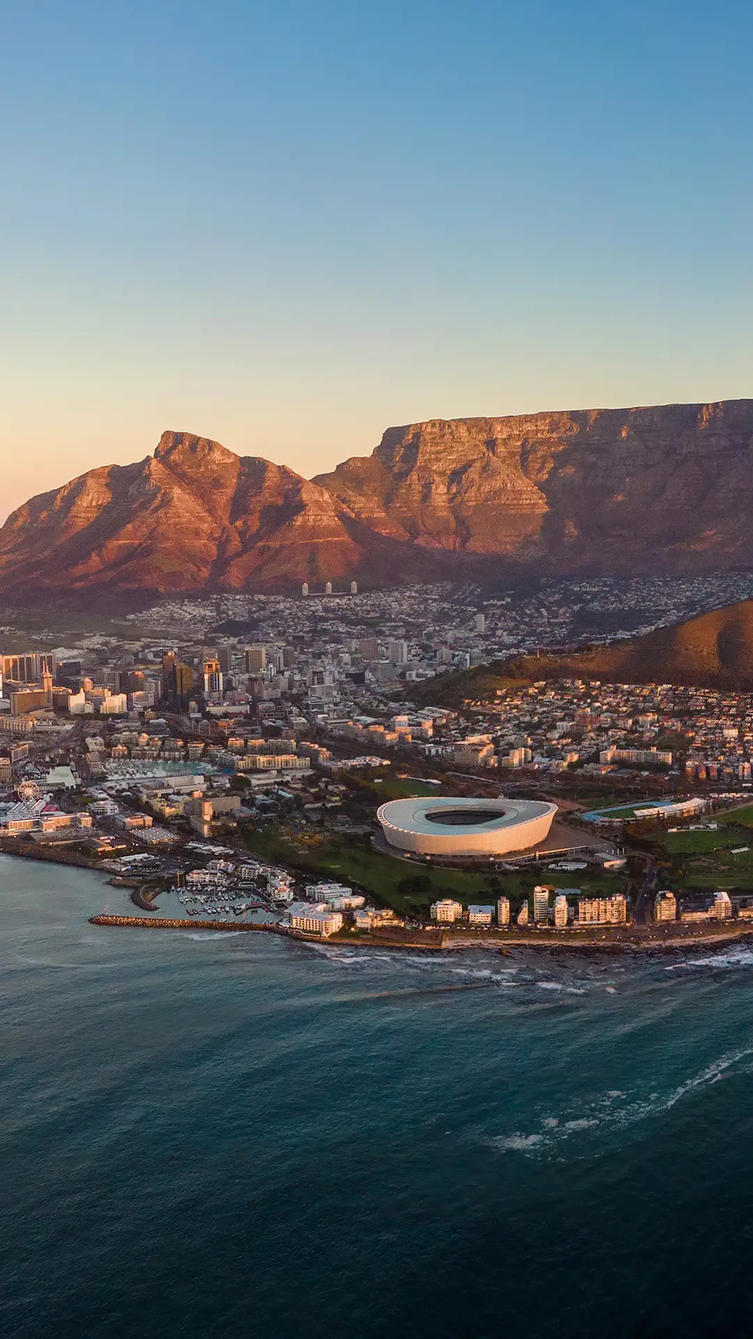 Aerial panoramic view of Cape Town cityscape at sunset, Western Cape Province, South Africa.