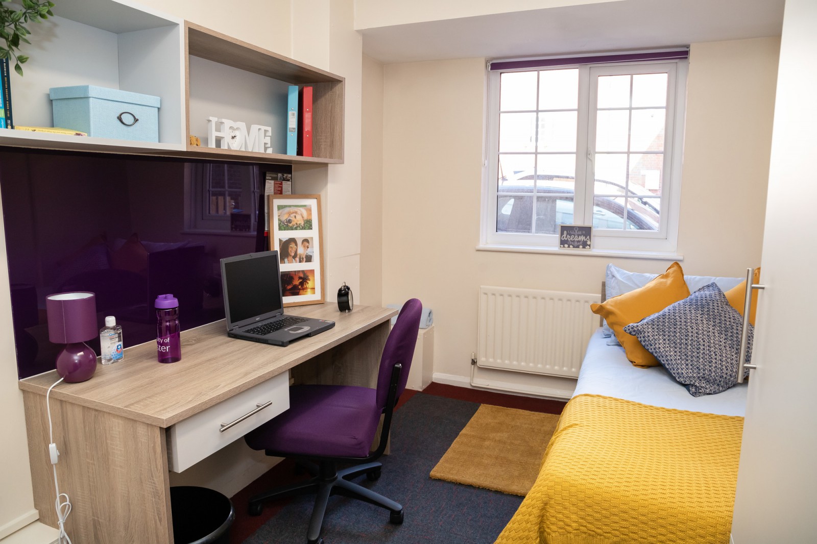 A bedroom and desk at Powys Court
