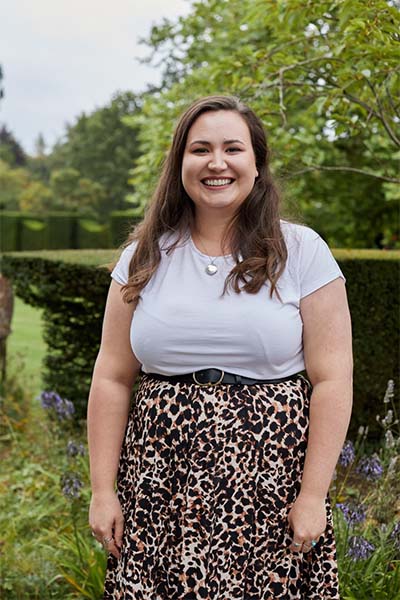 Emma standing outdoors in the garden