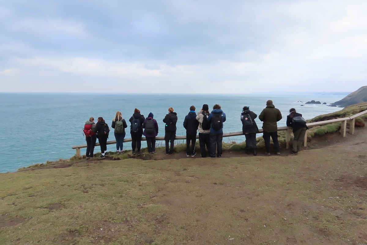 A photo of students and staff on a field trip to Cornwall