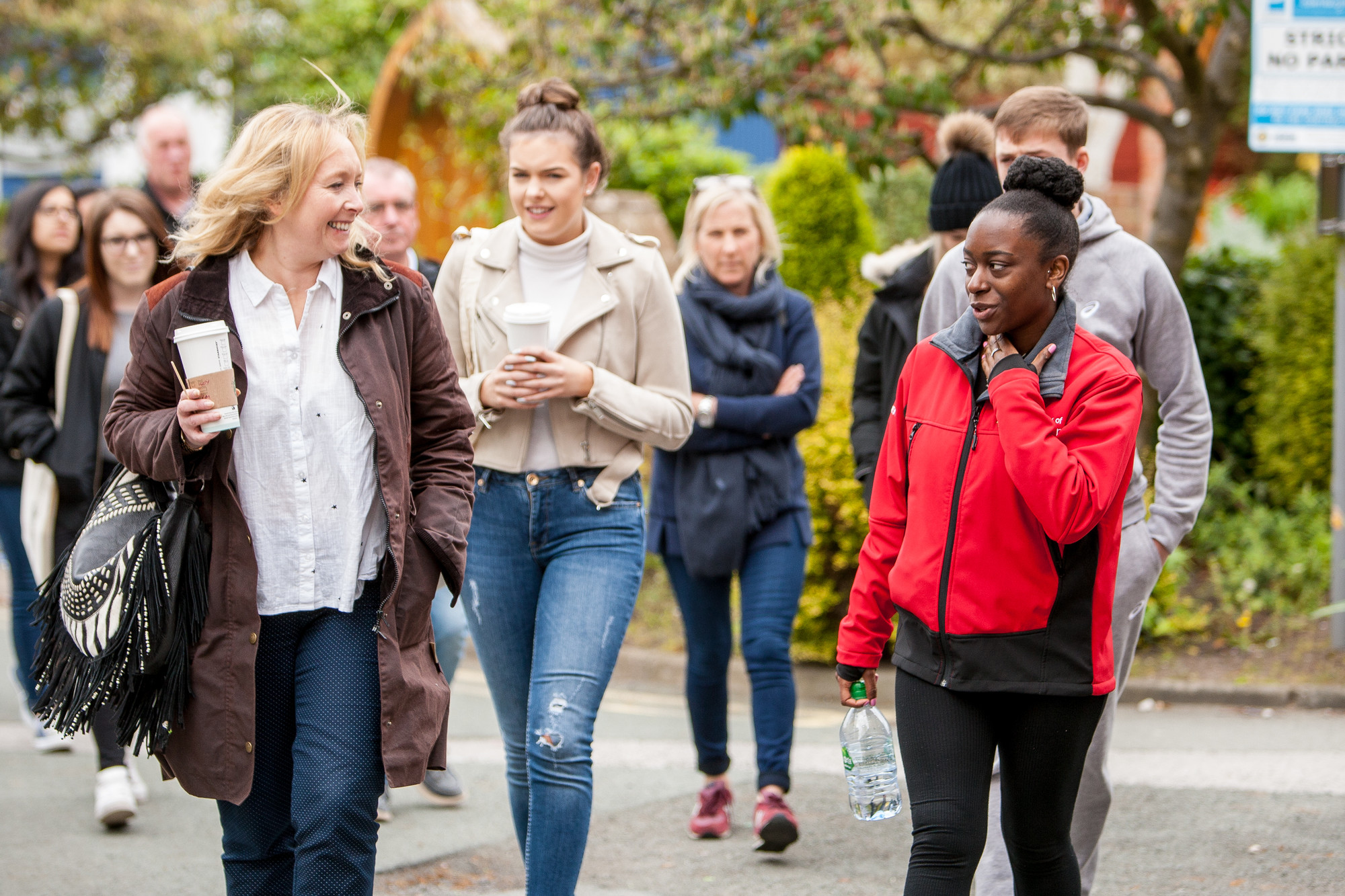 A group of parents and students walking on Chester campus
