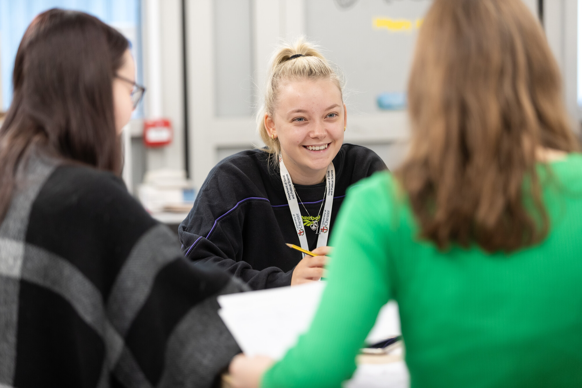 Three students chatting