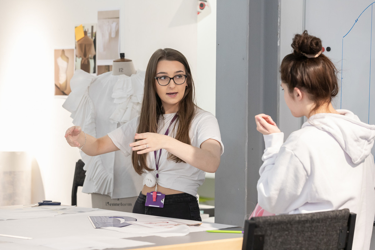 Two design students in a textiles studio