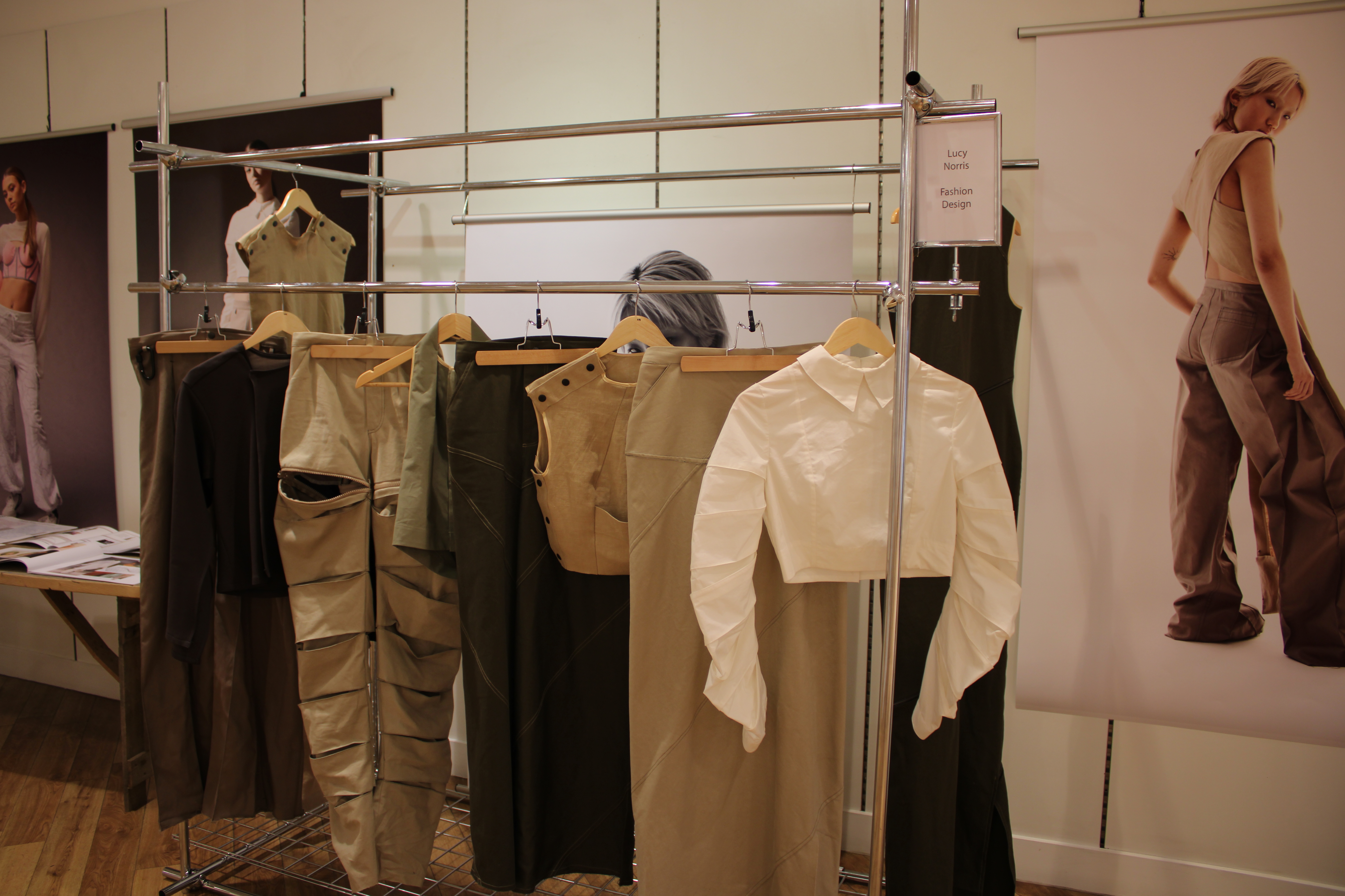 Neutral coloured clothing hung up on display