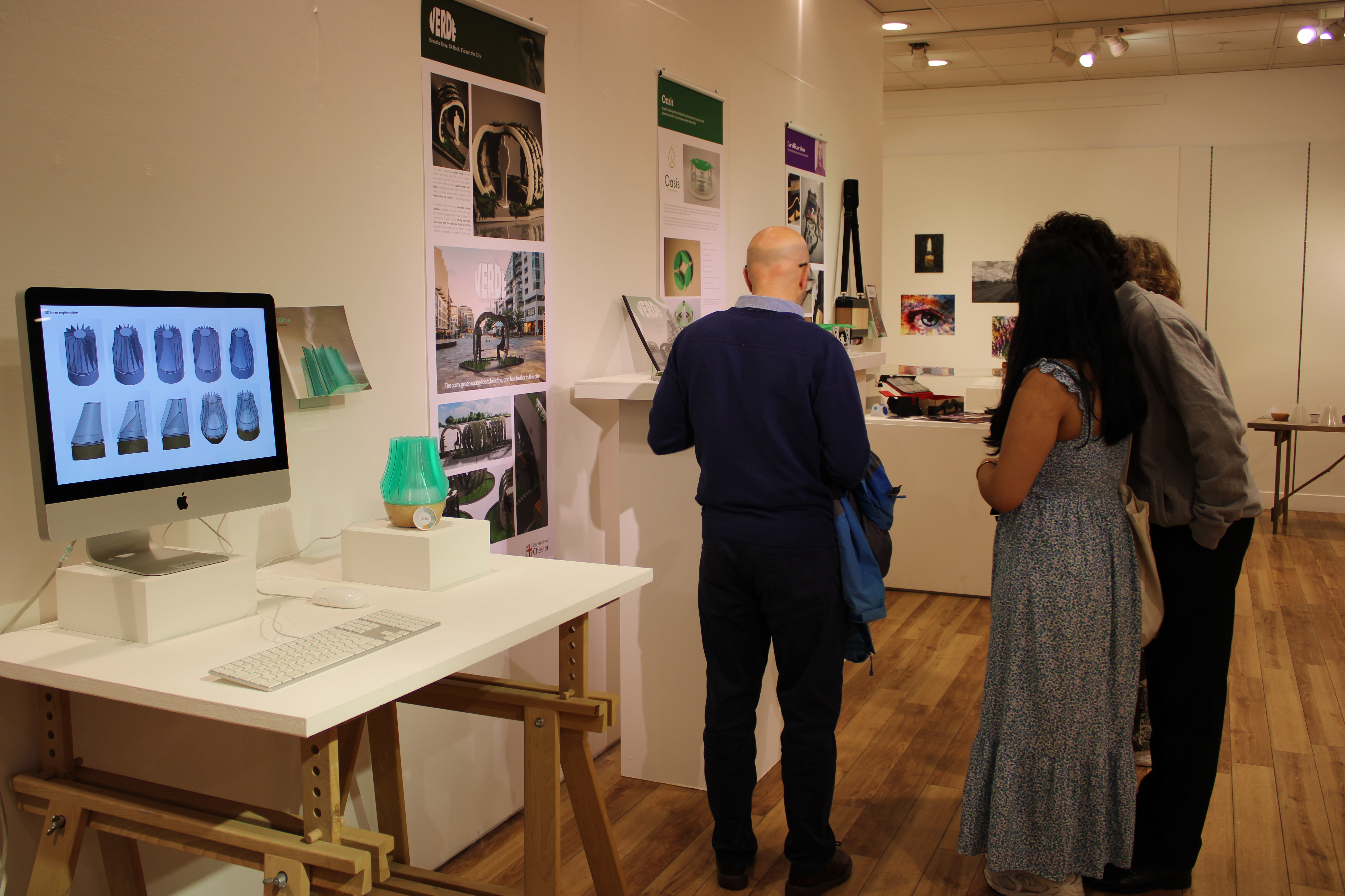 People looking at product designs on display
