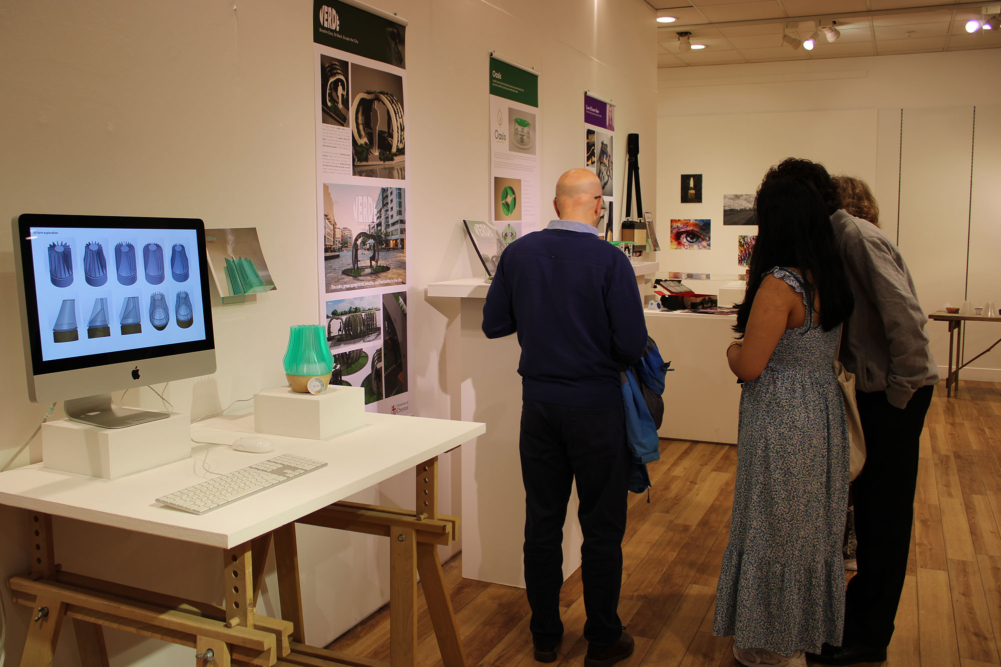 People looking at product designs on display