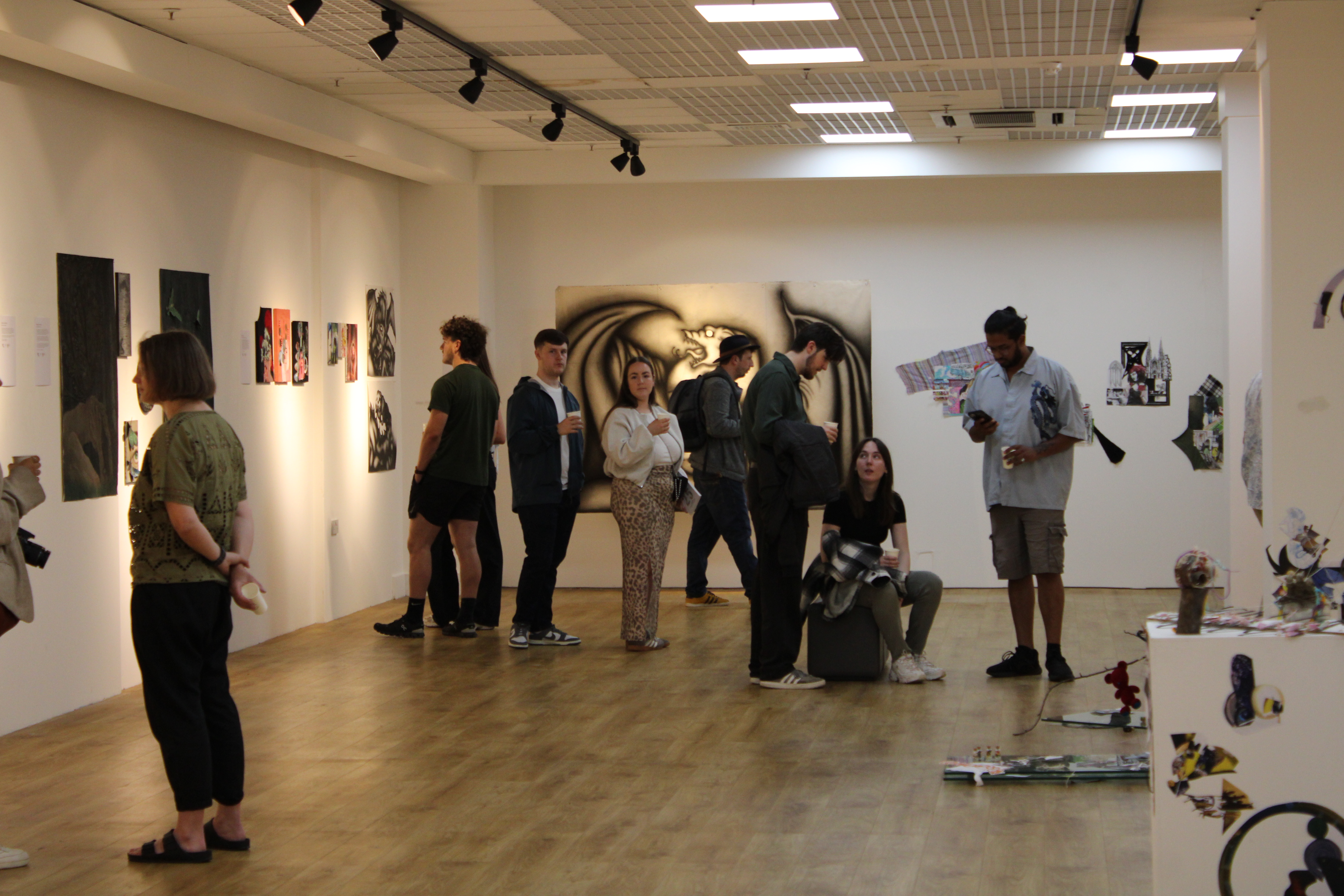 People looking at art exhibition