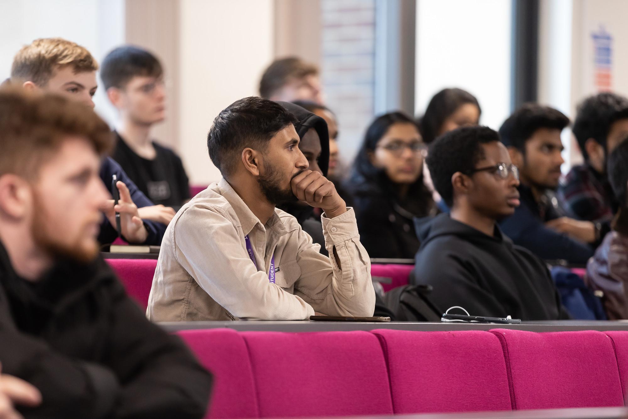Diverse international business students attending a postgraduate lecture, developing global management, leadership and cross-cultural communication skills on the International Business MSc at the University of Chester.