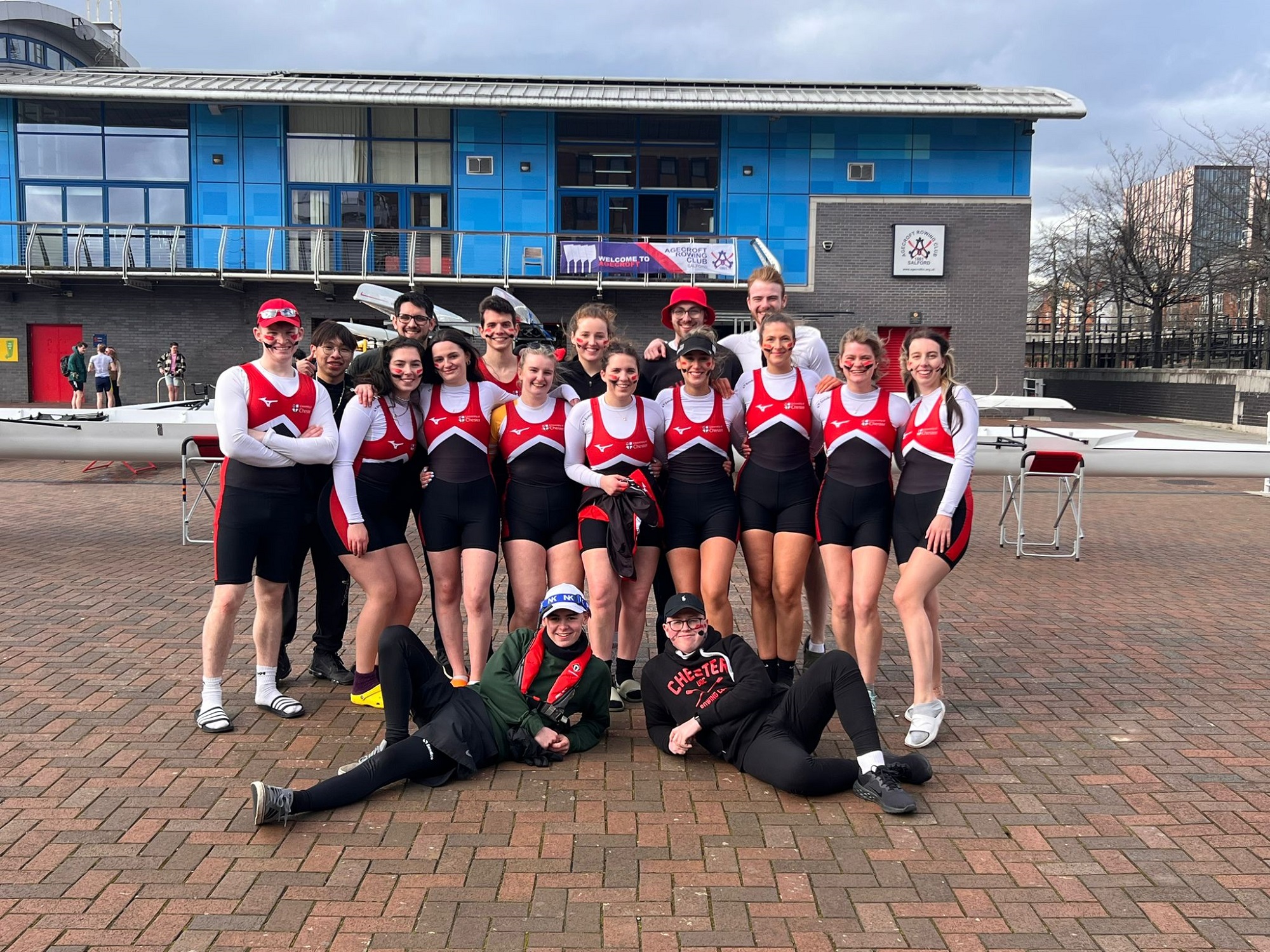 Rowing club students at a rowing meet.