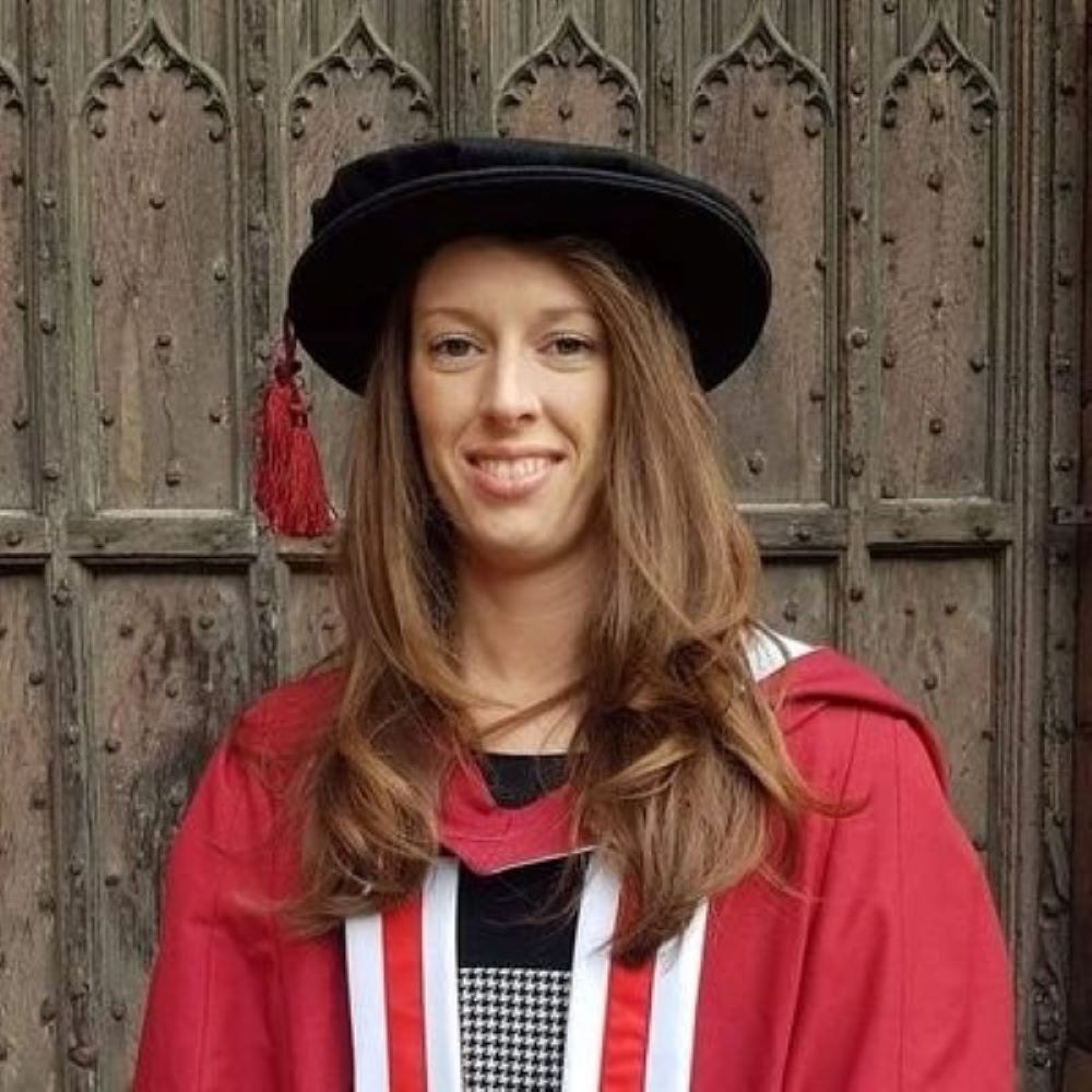 Dr Michelle Cordingley in her PhD graduation cap and gown