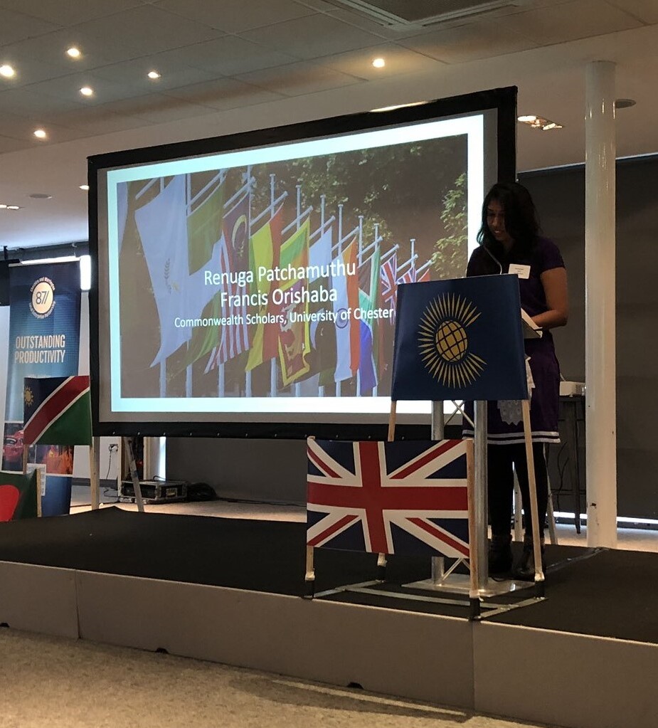 Renuga delivering a speech at the Commonwealth Day 2018 celebration as a Commonwealth Scholar