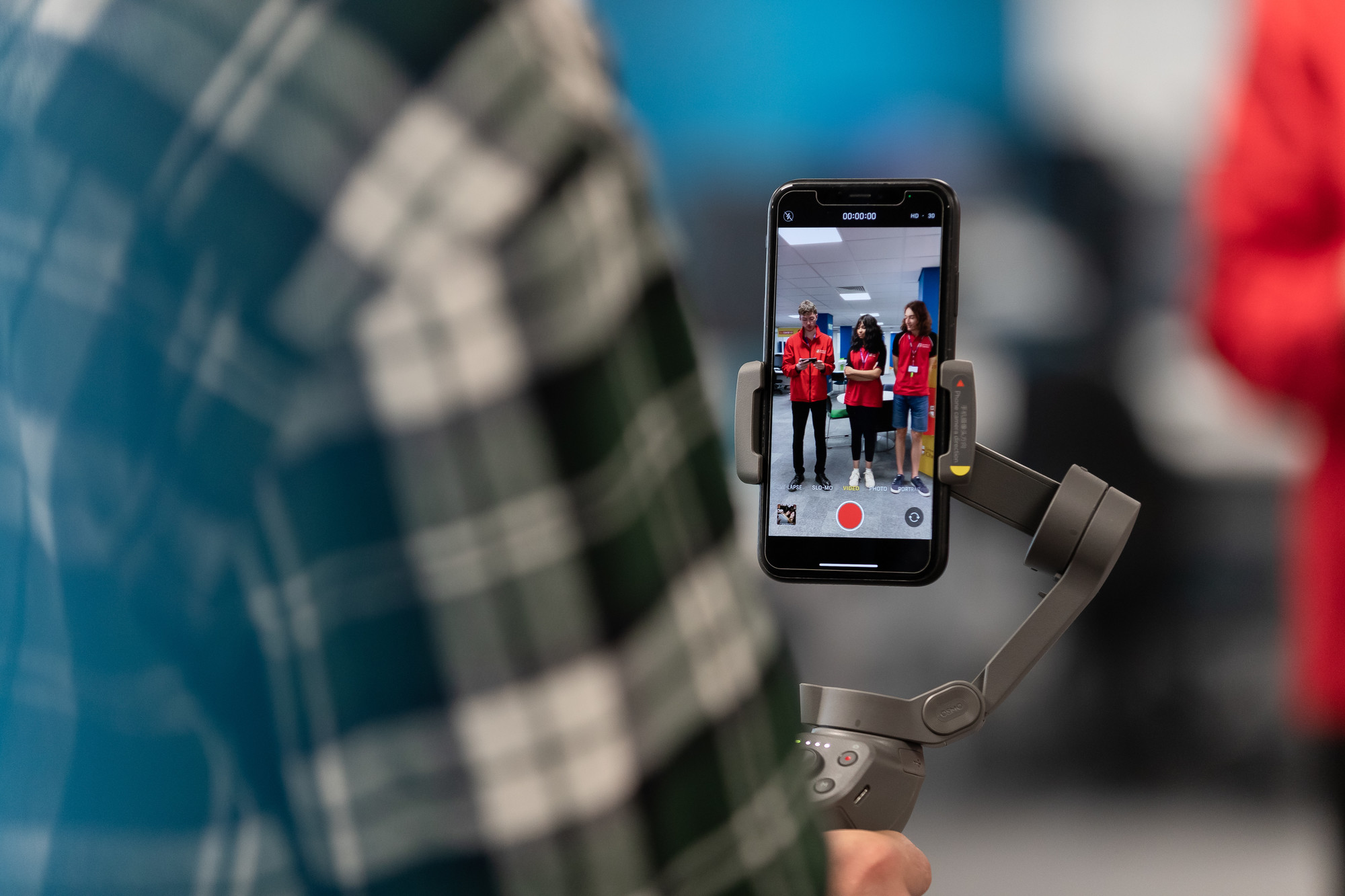 Man holding a phone using a gimbal filming content