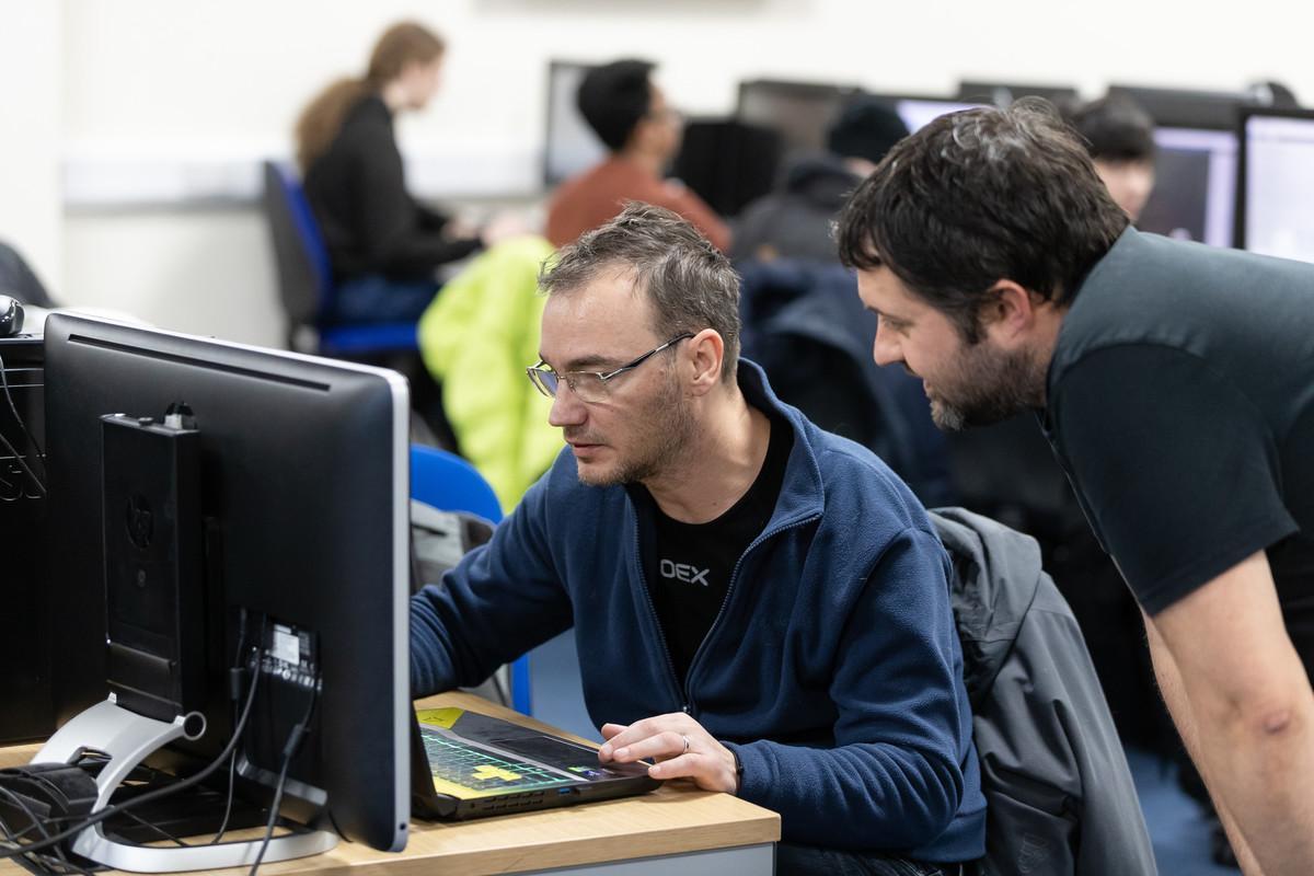 Researchers analysing scientific data in a computer laboratory, representing the Natural Sciences MRes at the University of Chester.