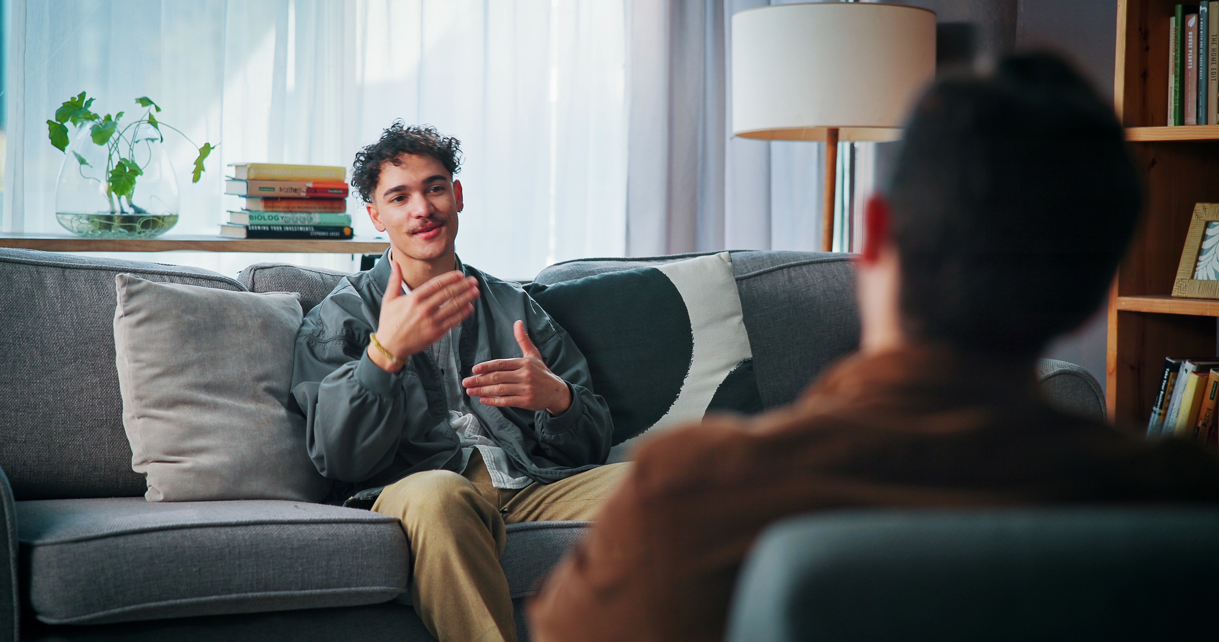 man with counsellor in office for advice, help or life coaching session