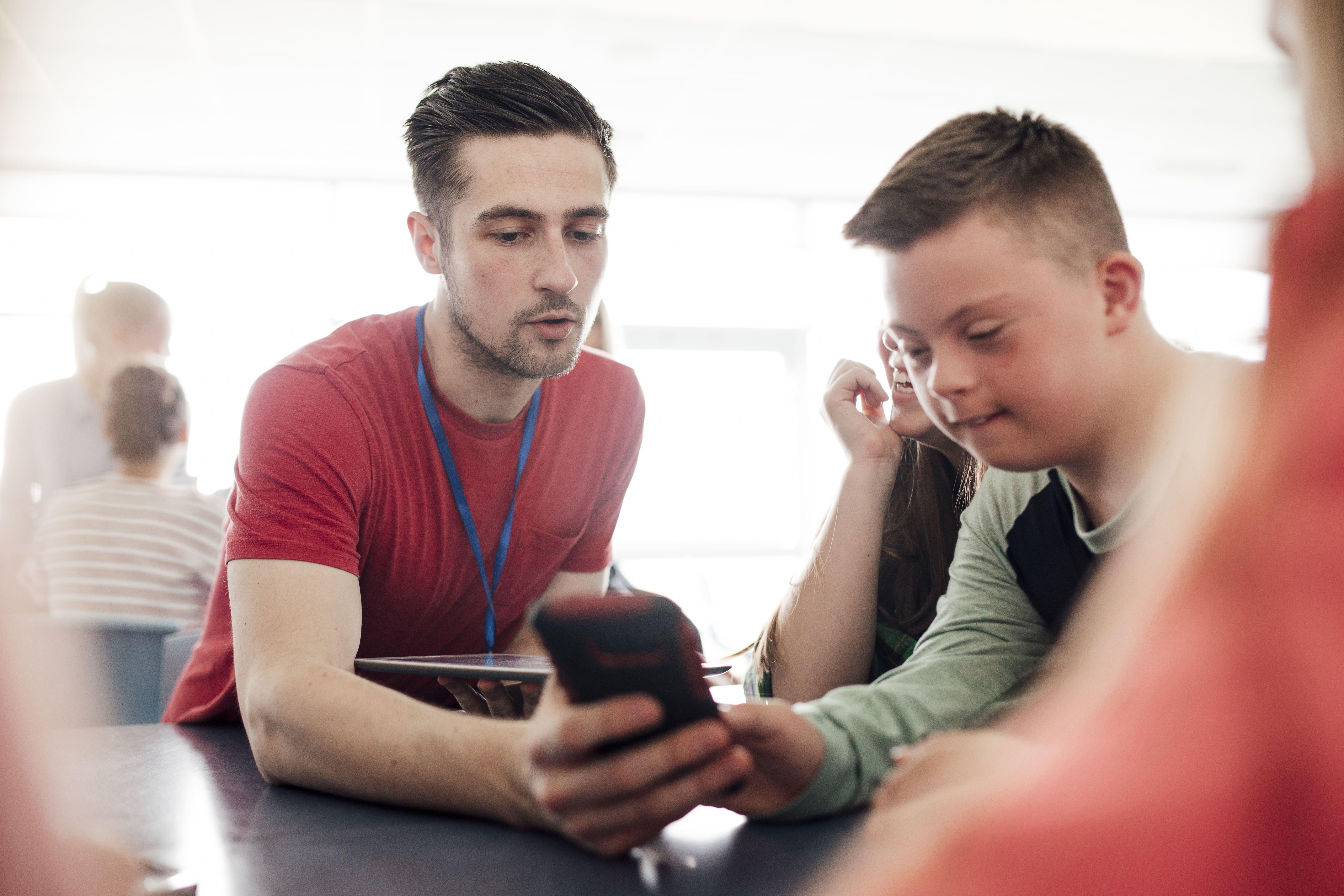Student and learner working together in an inclusive educational setting, reflecting the Special Educational Needs and Disability (SEND) PGCert at the University of Chester and its focus on supporting diverse learning needs.