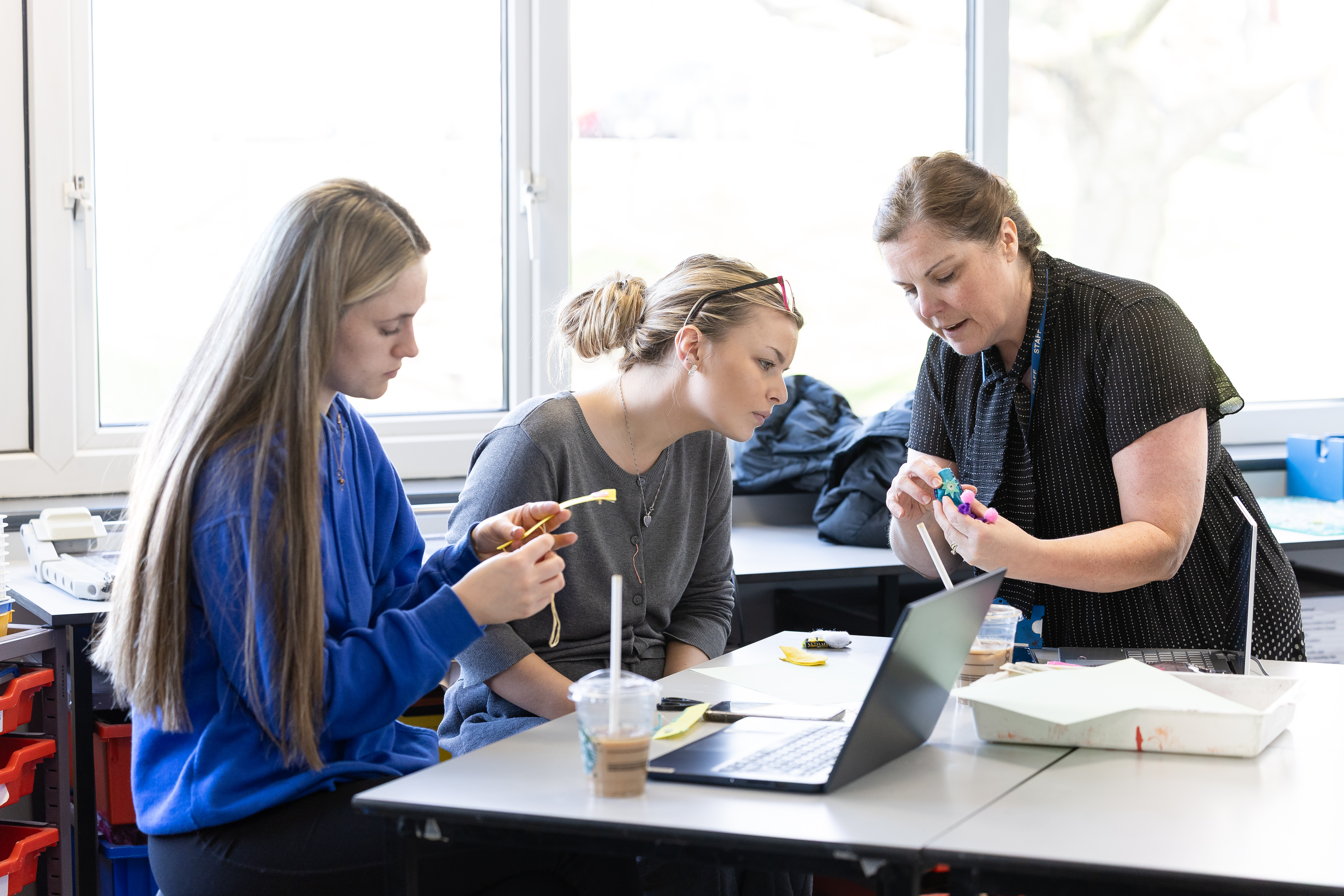 tutor showing students a demonstration