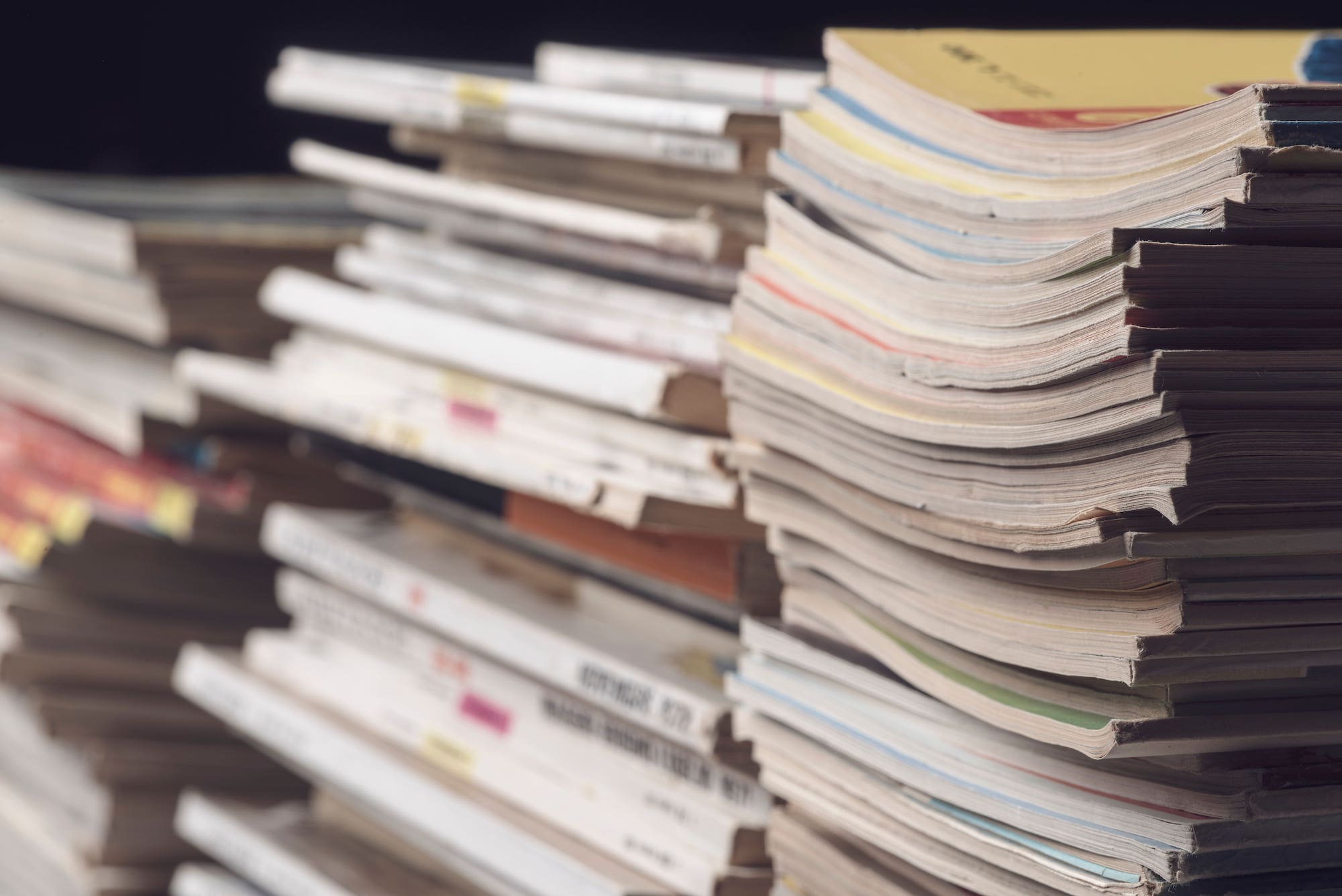 piles of old newspapers and magazines