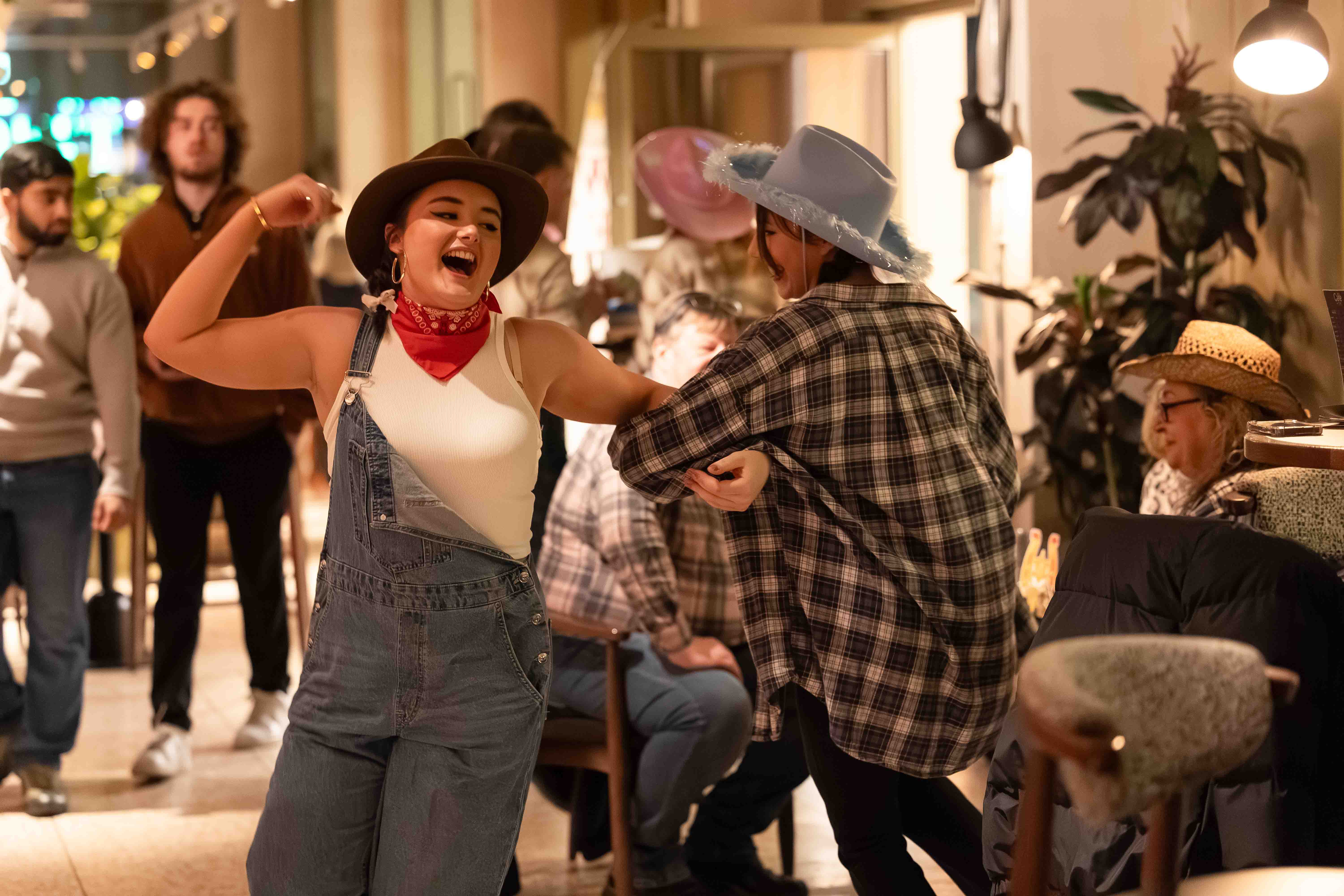 two students dancing at event