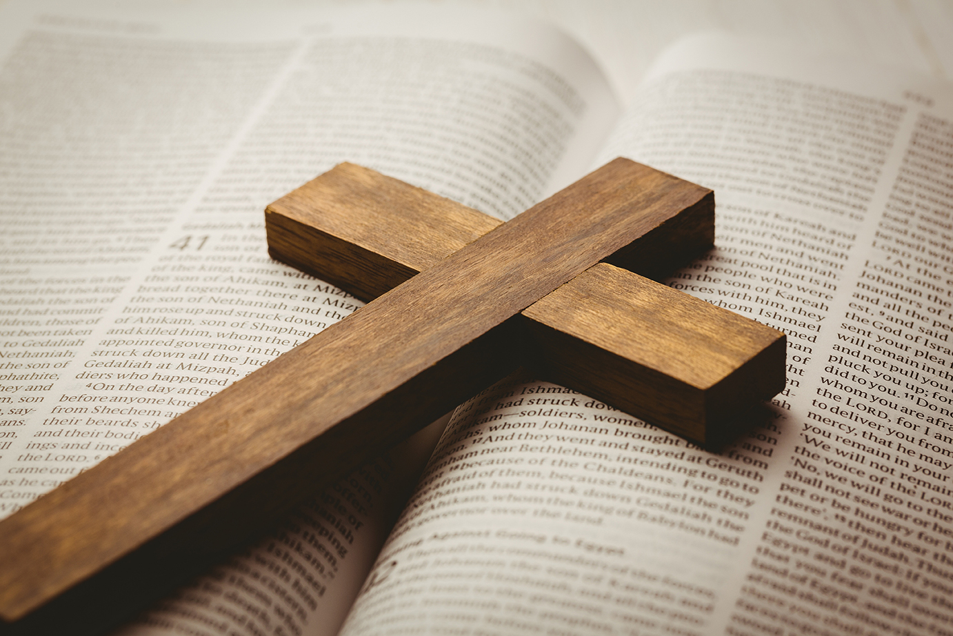 Methodist cross on top of the bible