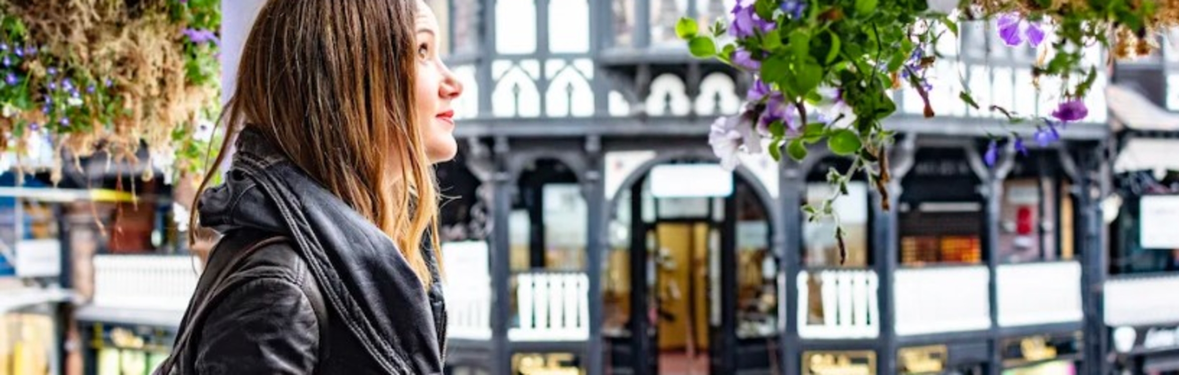 Generic image of a girl in front of building