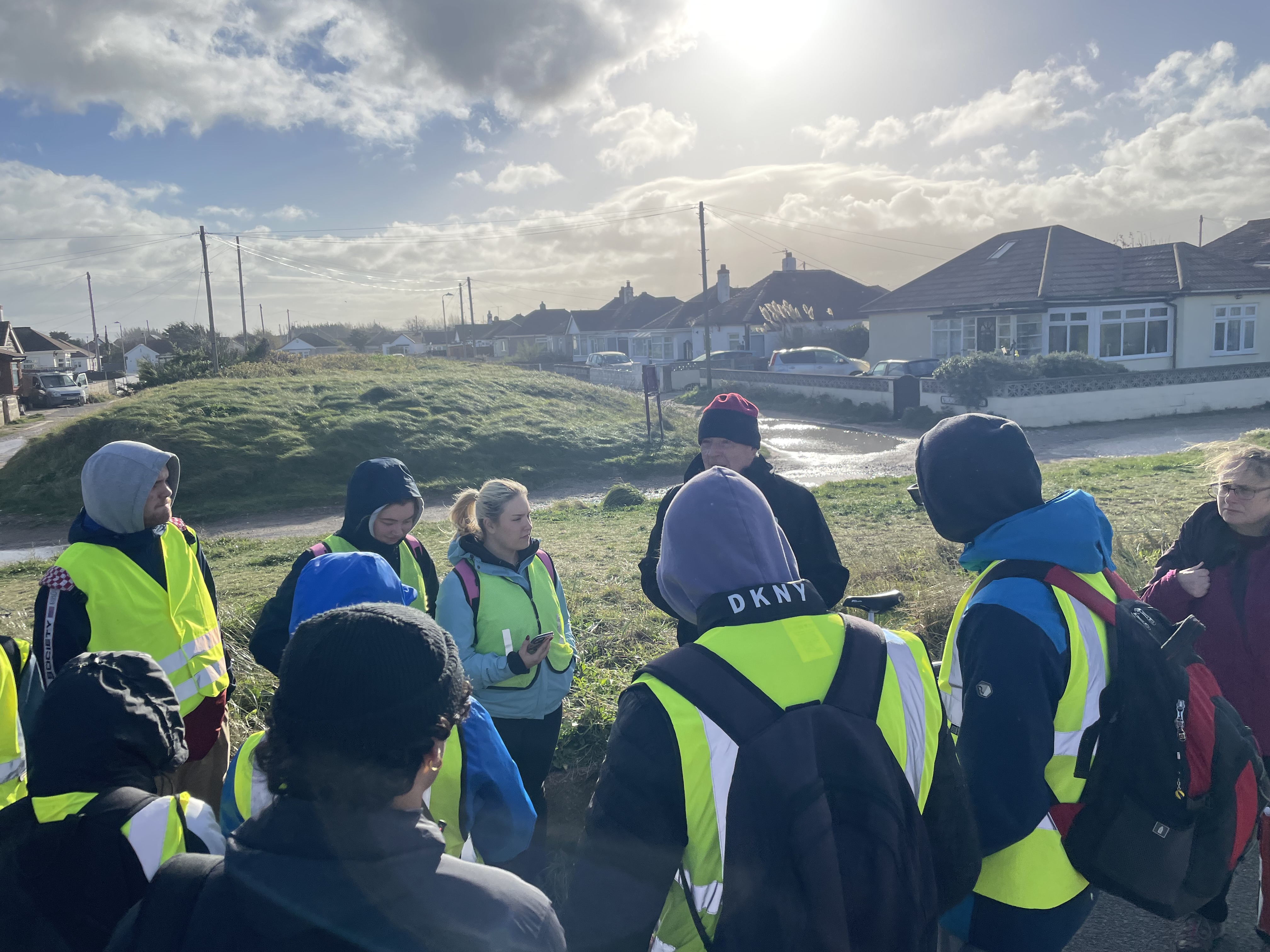 students at geo trip in high vis