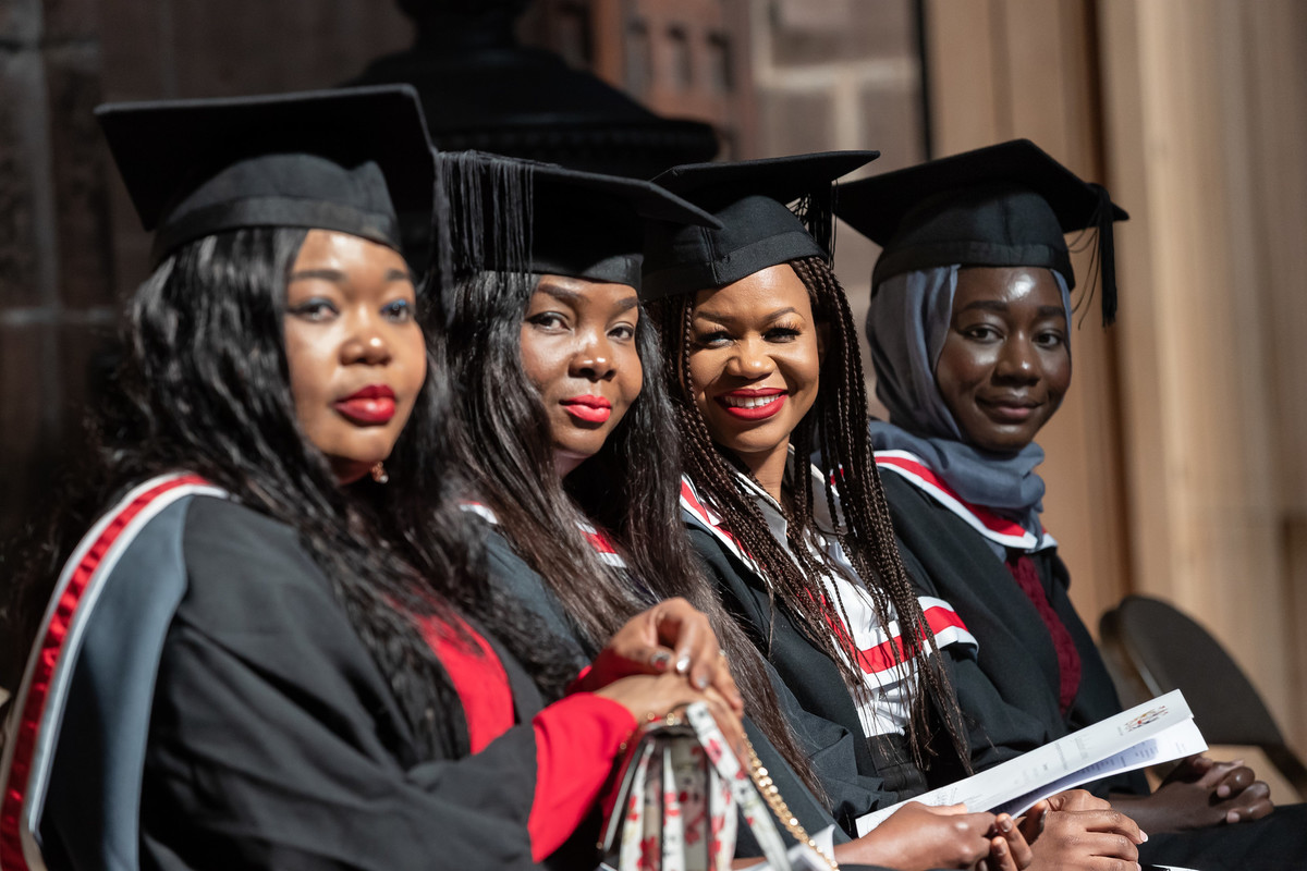 A group of students wearing graduation clothing