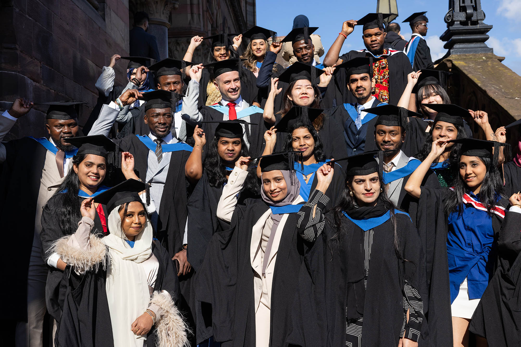 A group of students wearing graduation clothing