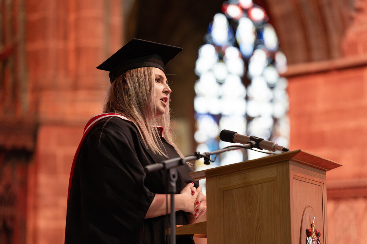 A graduate speaking at a graduation ceremony