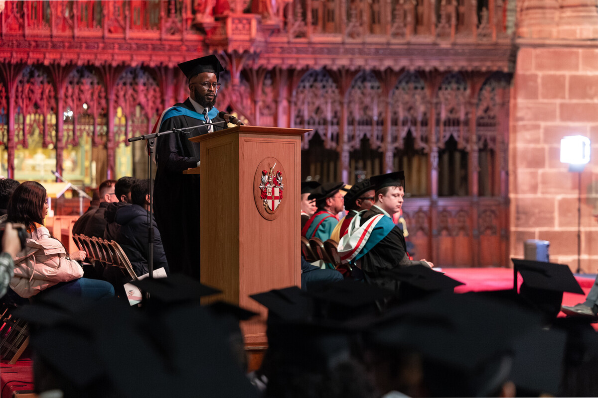 A graduate speaking at a graduation ceremony