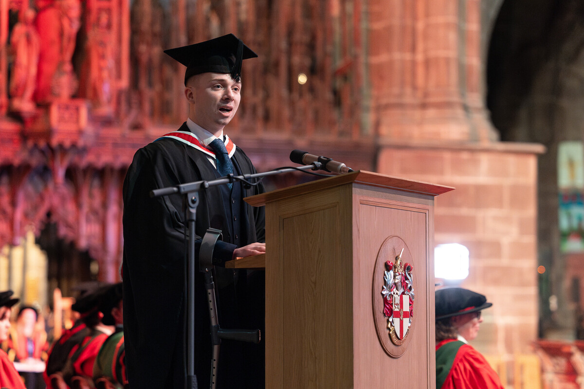 A graduate speaking at a graduation ceremony