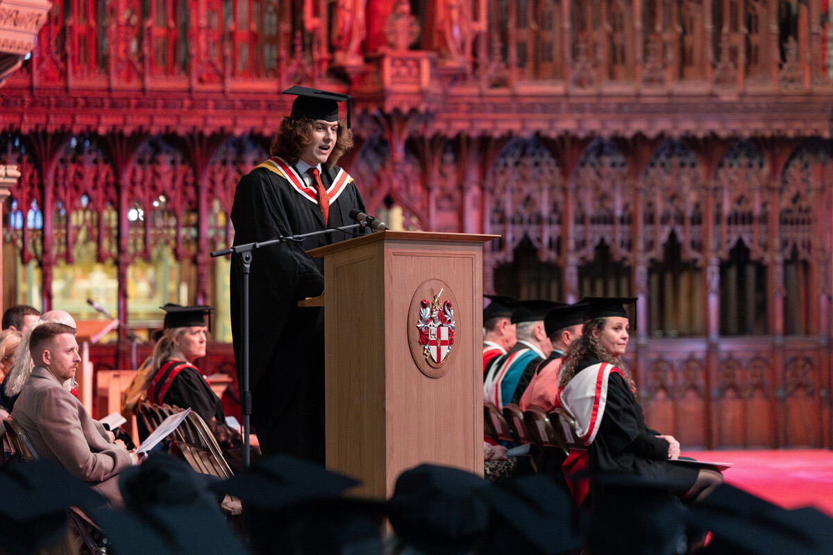 Graduate speaking at ceremony