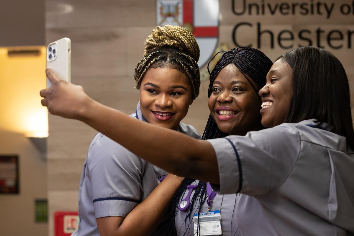 Three nursing students take a selfie together at the University of Chester, celebrating their studies in the Nursing Studies (International Top-up) BSc programme.