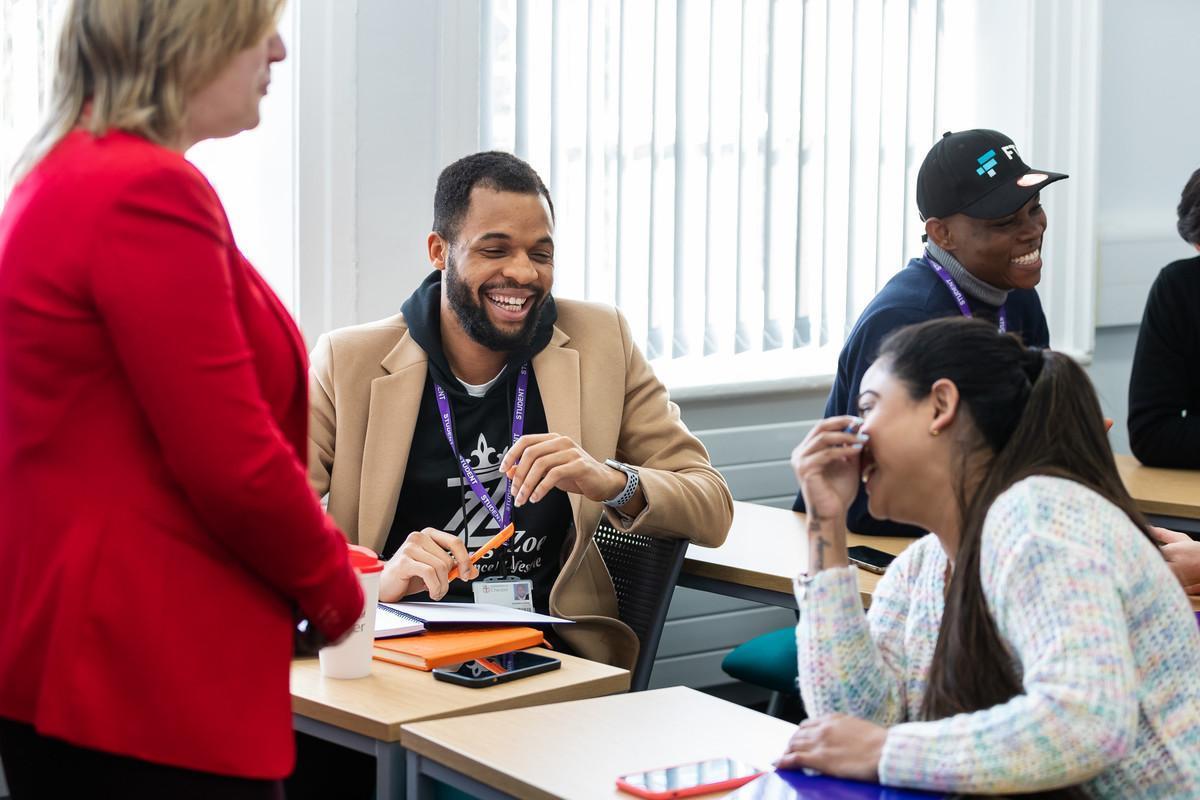 Postgraduate students on the TESOL MA (Teaching English to Speakers of Other Languages) course engage in collaborative learning during a university seminar, developing advanced English language teaching and applied linguistics skills.