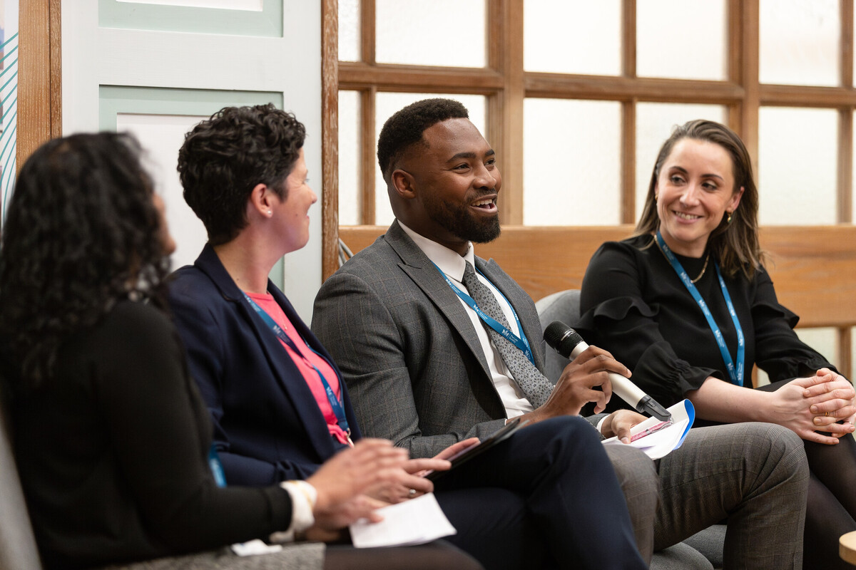 law society students in suits smiling in a group