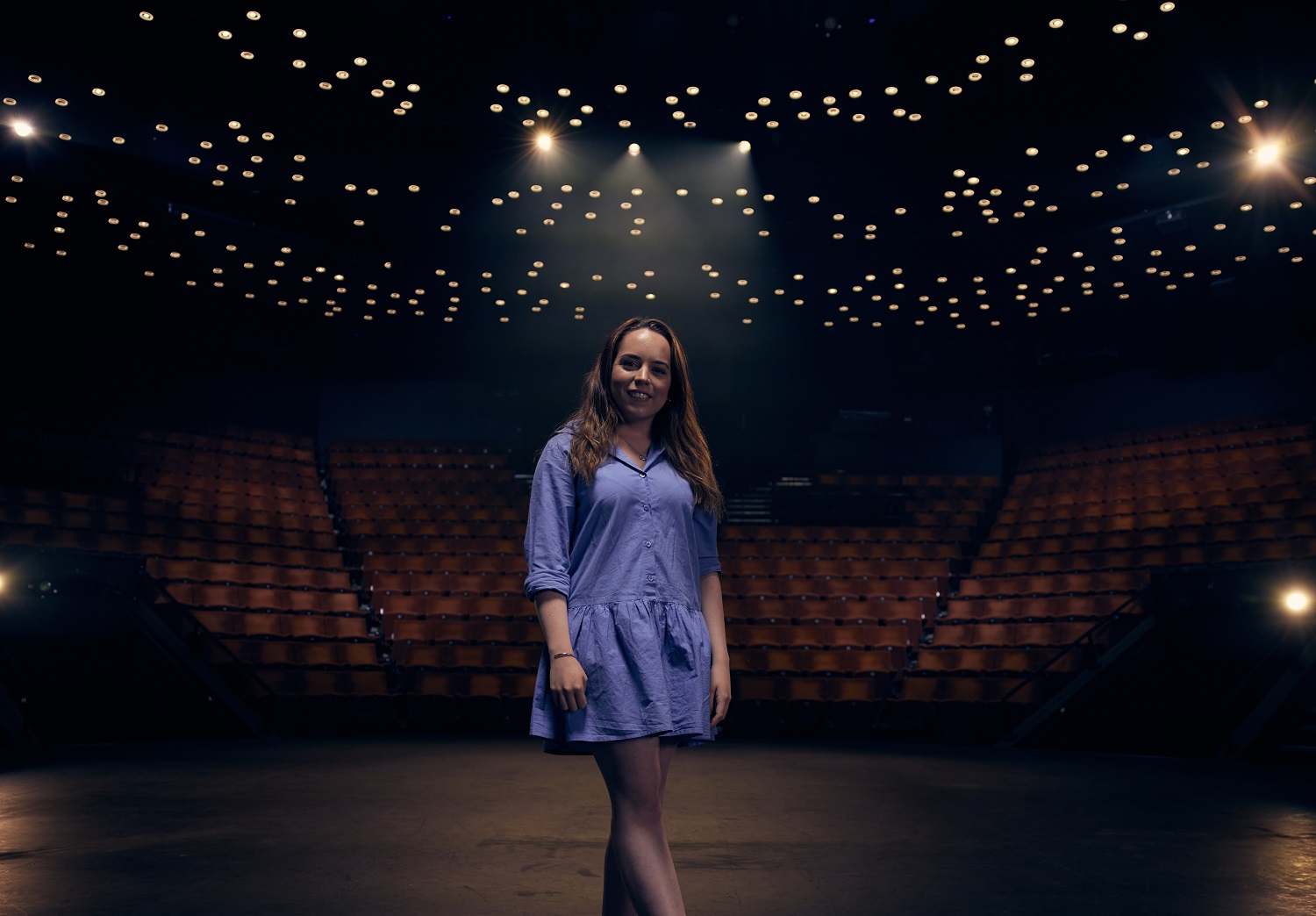 Lauren Sumner - Digital Marketing graduate stood on a stage