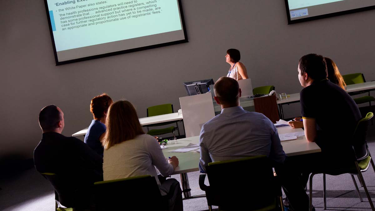 A group of people in a meeting