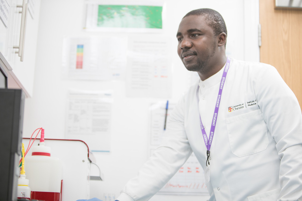 A medical student using lab equipment