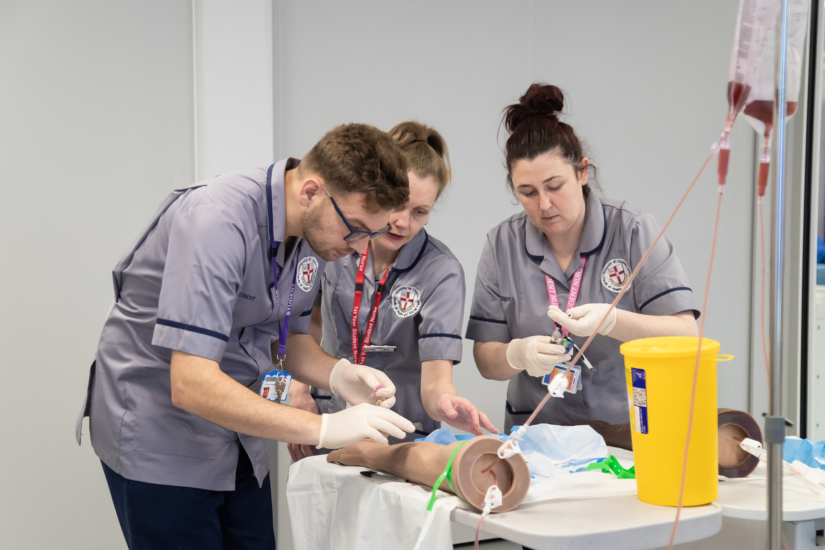 Students working in the Nursing simulation suite