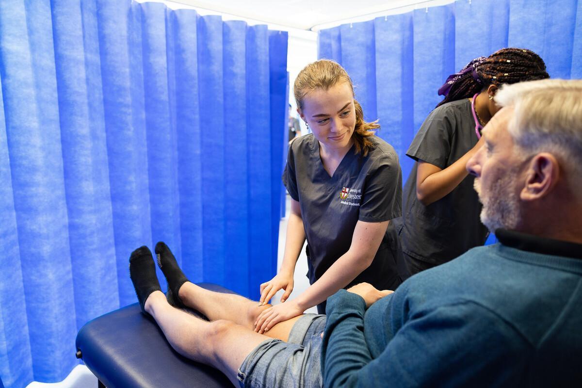 Graduate Entry Medicine students practicing clinical skills and patient care during a hands-on training session.
