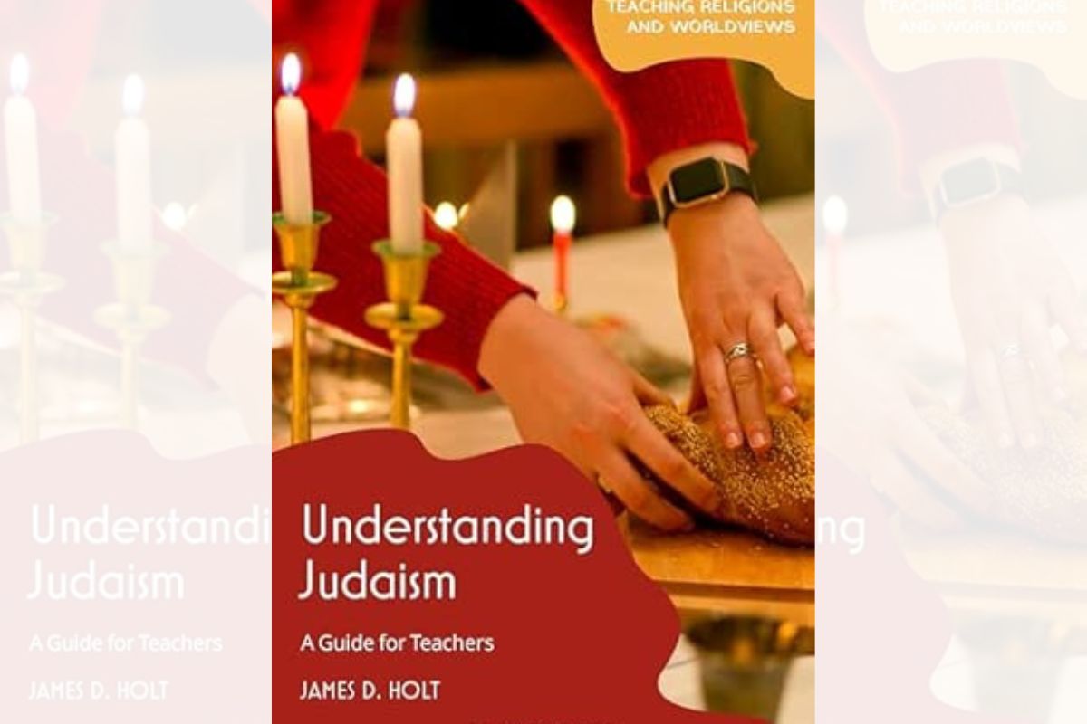 The cover to the book Understanding Judaism: A Guide for Teachers. The main image is of two hands taking a piece of Challah bread. Several candles on candlesticks are also lit.