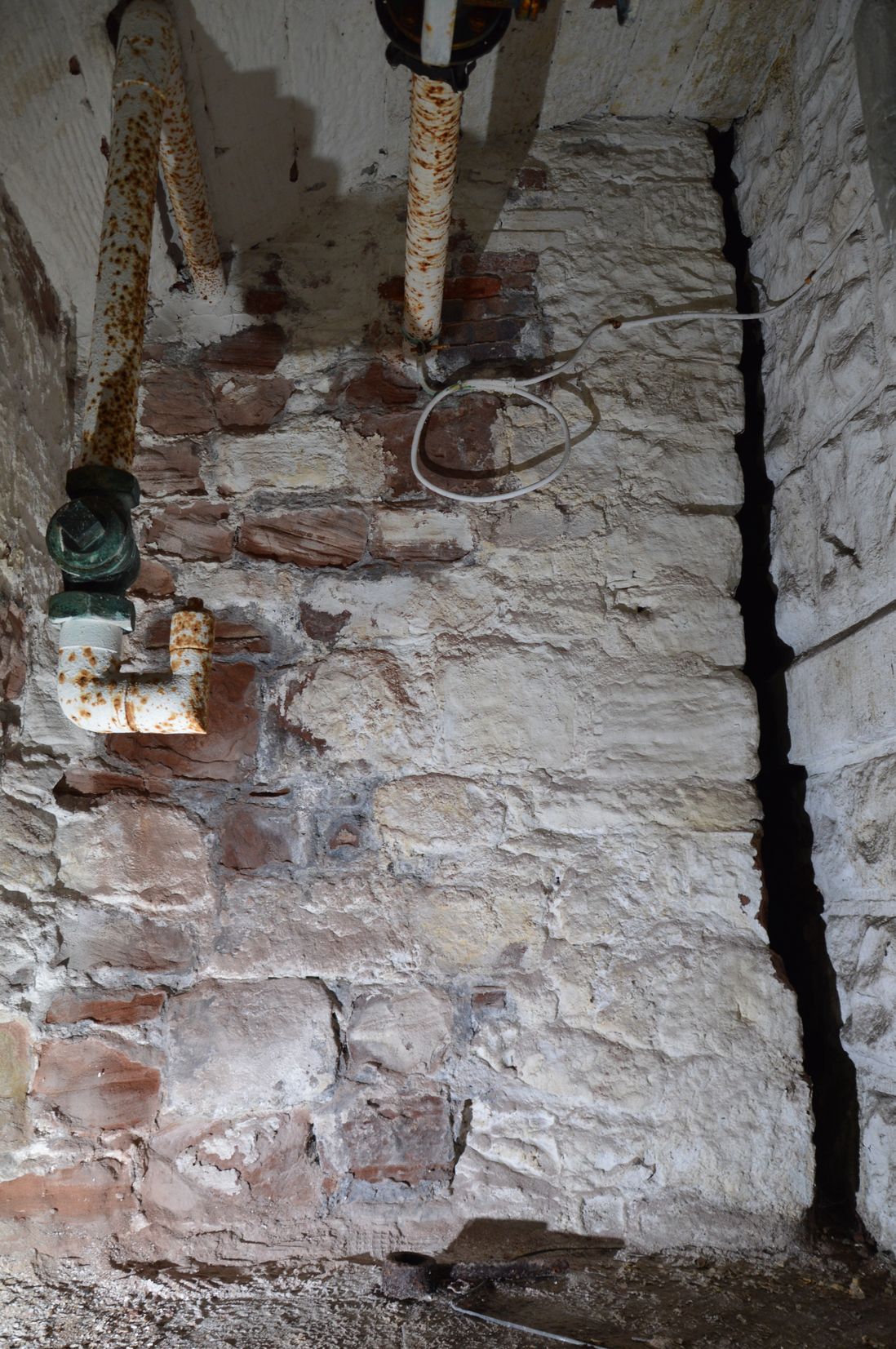 Remains of the bridge to Chester Castle recently discovered below the Crown Courts. The photo shows a small gap in a stone wall.