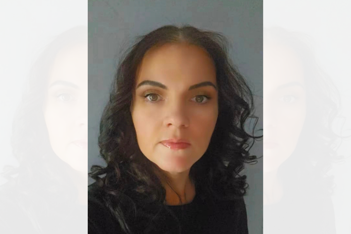A head and shoulders photo of Emma Lennon, looking at the camera.