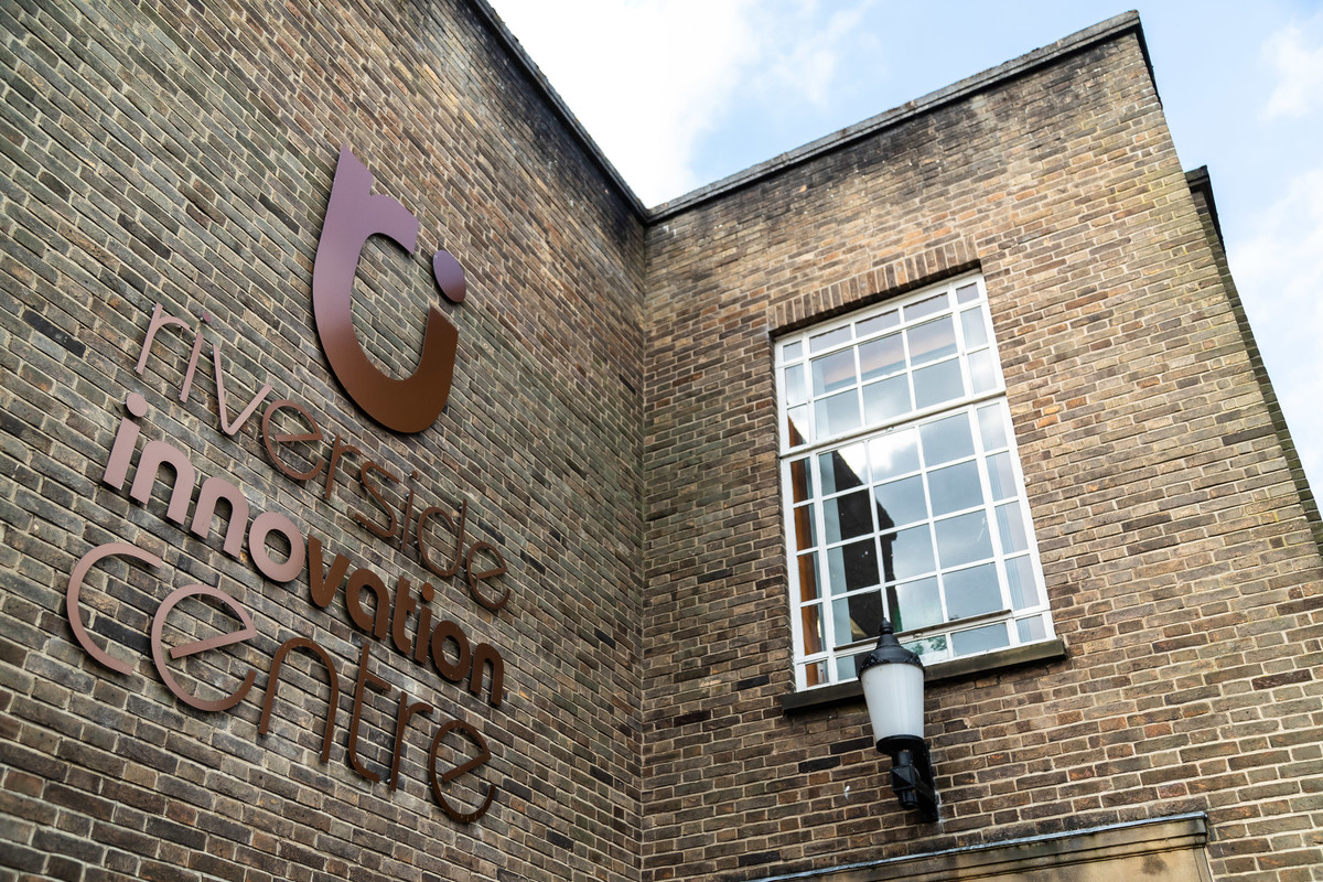 A close-up exterior shot of the Riverside Innovation Centre, with the building