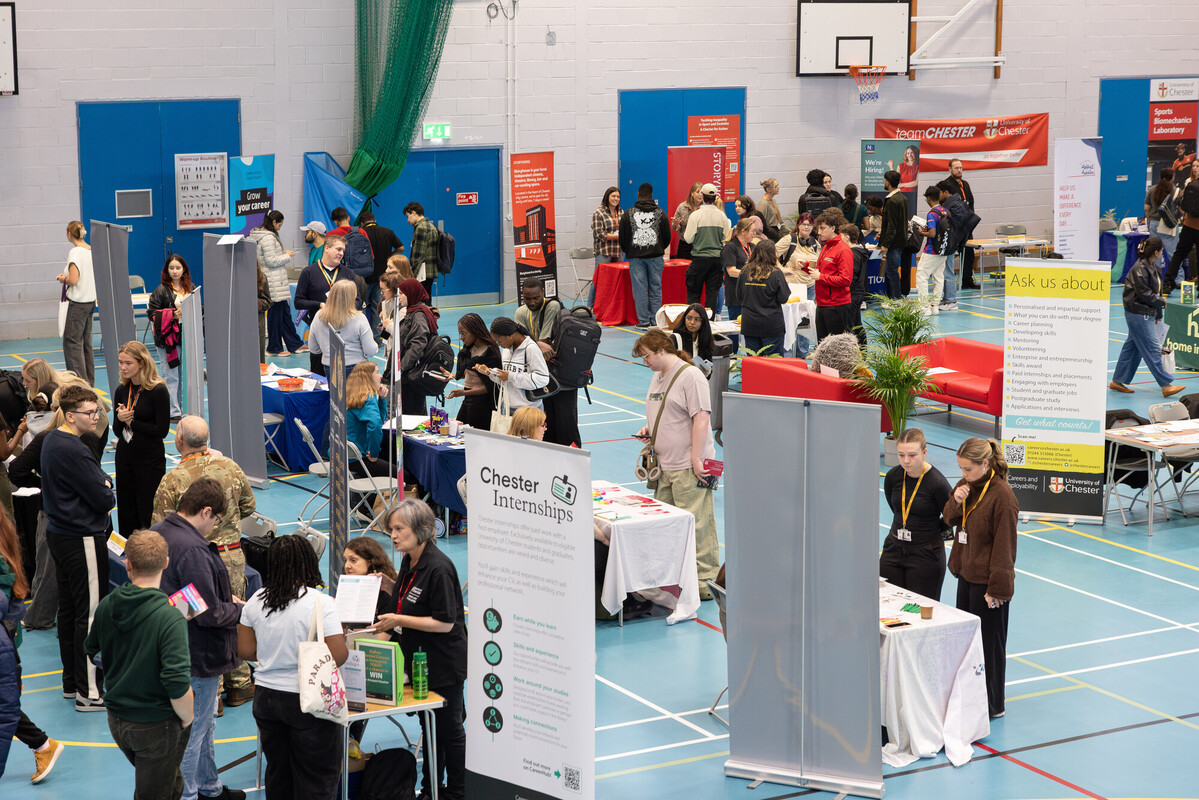 A busy hall filled with people looking at stalls and stands at the Part-time Jobs Fair.