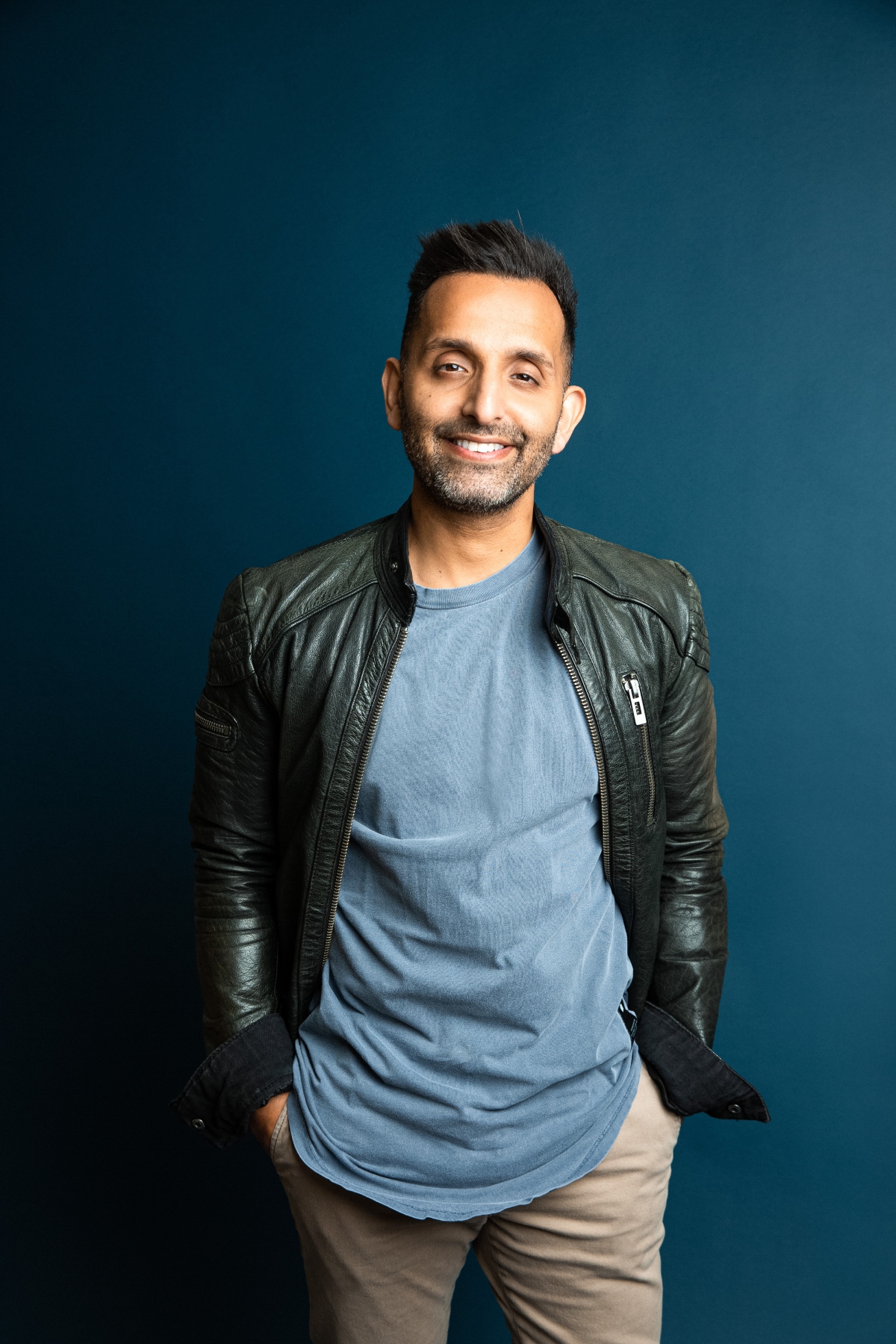 Portrait photo of Dr Amir Khan looking at the camera