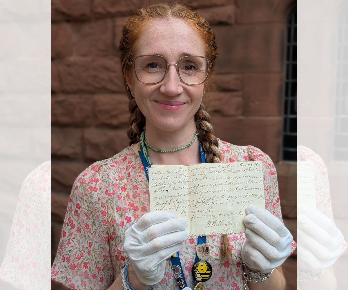 University of Chester Alumni Assistant, Amy Hultum, showing William Wilberforce’s signature at the end of one of his letters to Henry Raikes.