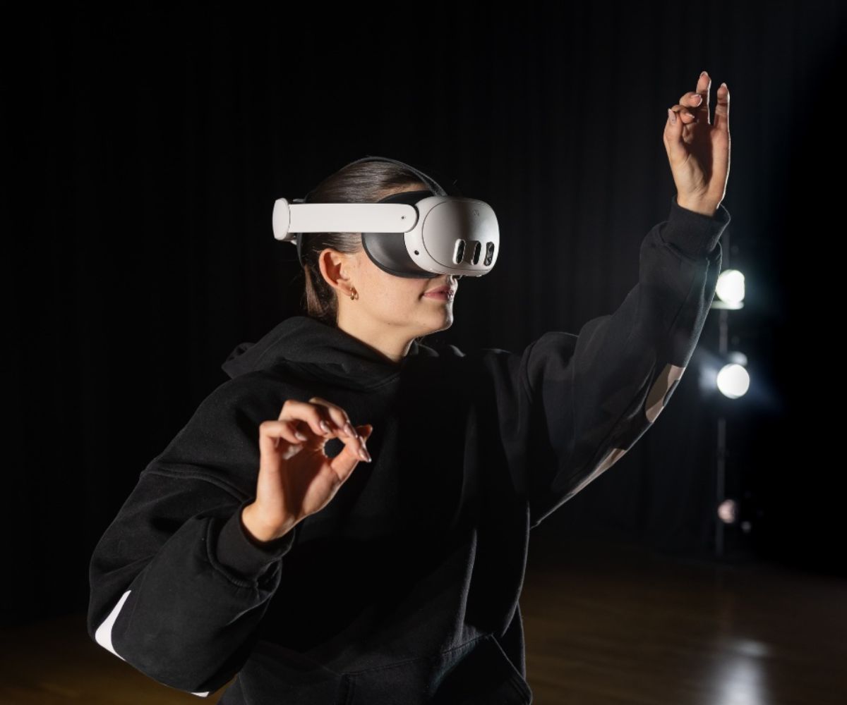 A dance student with a VR headset.