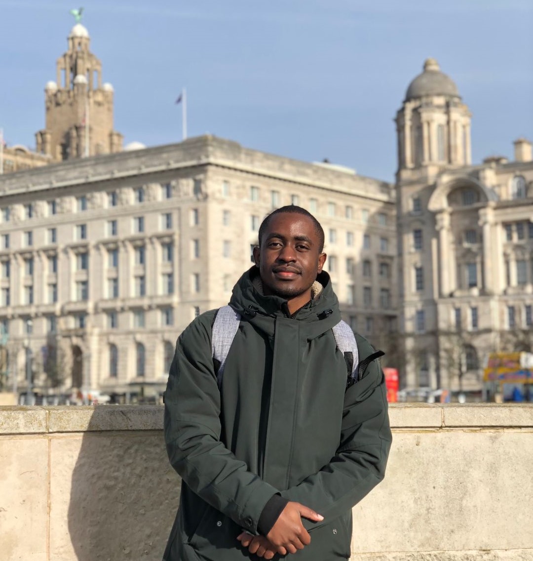 student in front of landmark